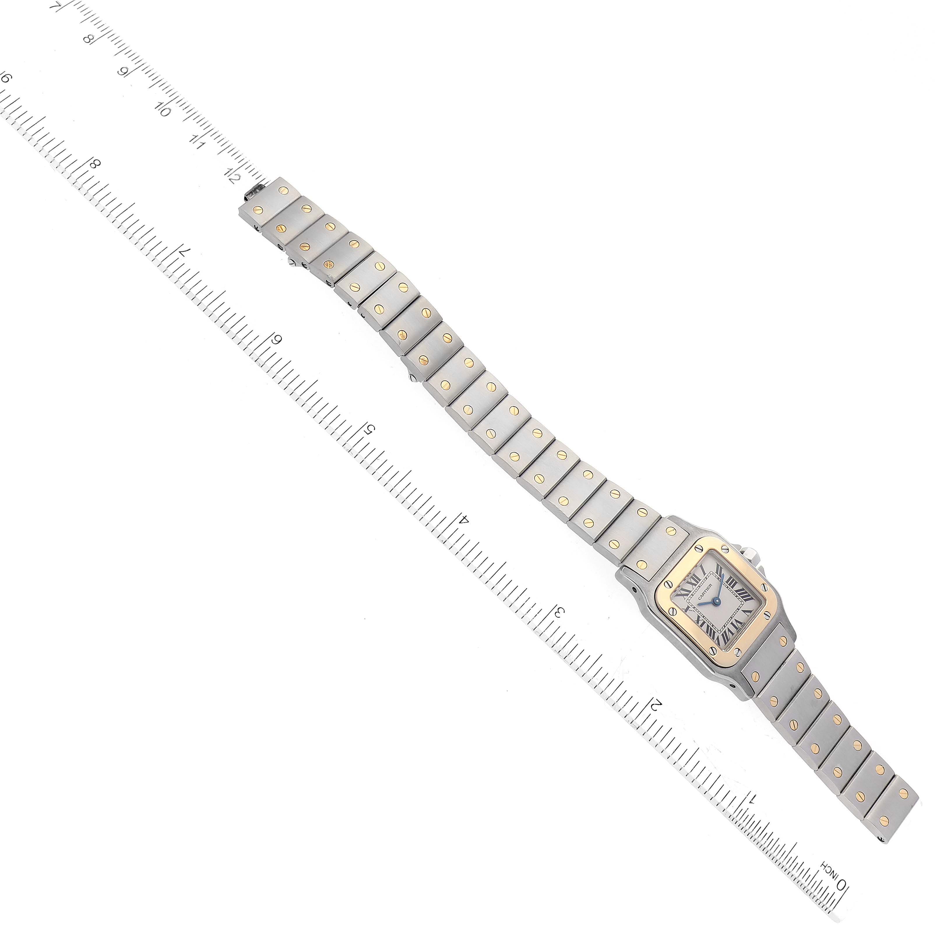 This image shows a top-down view of a Santos model by Cartier, displaying the entire watch including the face and bracelet.