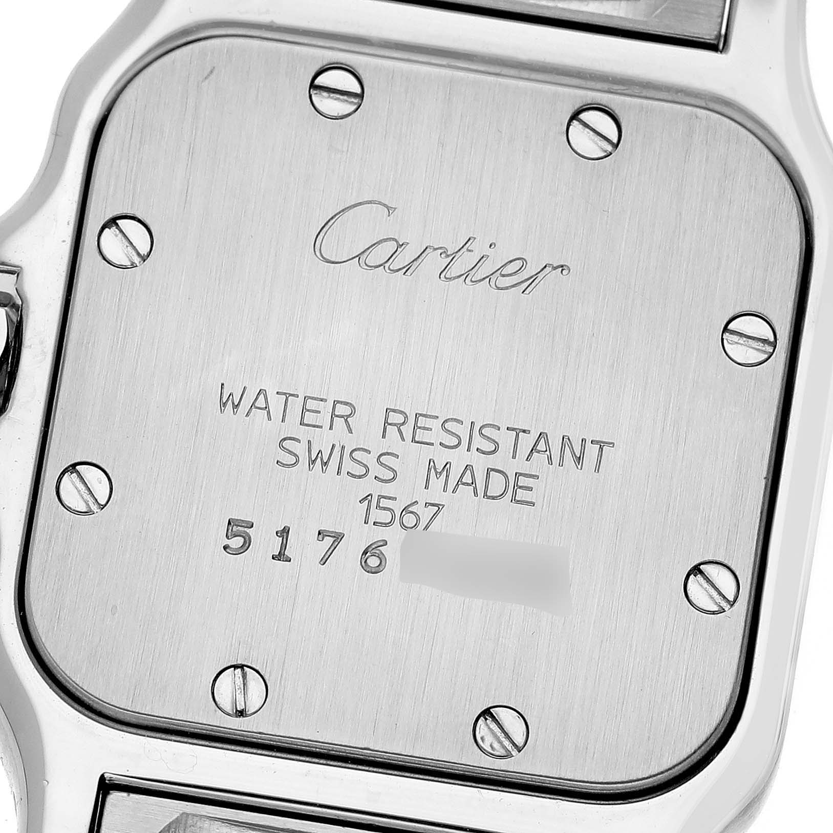 This image shows the back case of a Cartier Santos W20012C4 Women's Steel and Gold (two tone) Silver Dial W20012C4 Women's Steel and Gold (two tone) Silver Dial watch, viewed from a top-down angle.