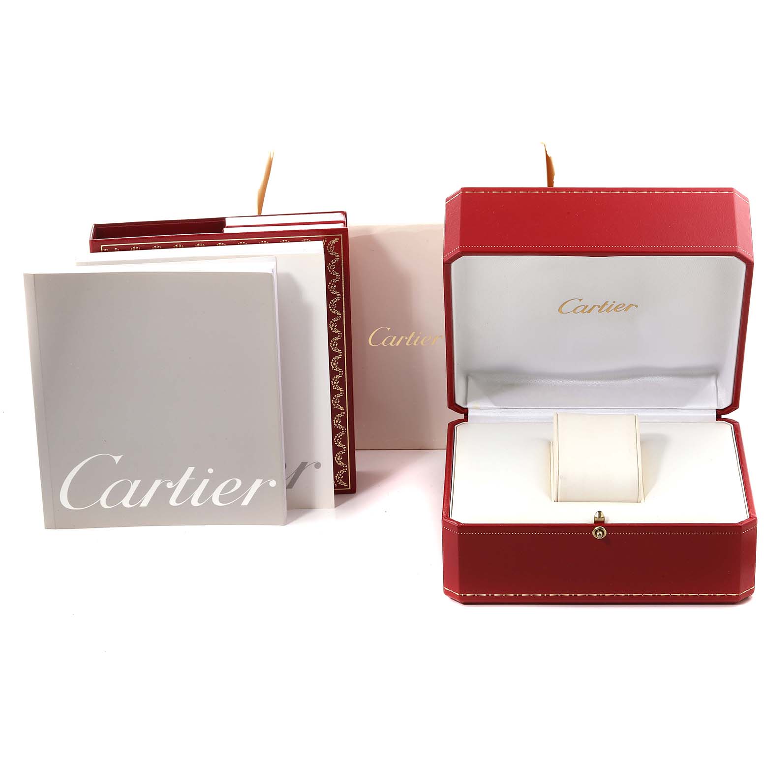 The image shows the packaging and manuals for a Santos model by Cartier, including the red watch box and documents.