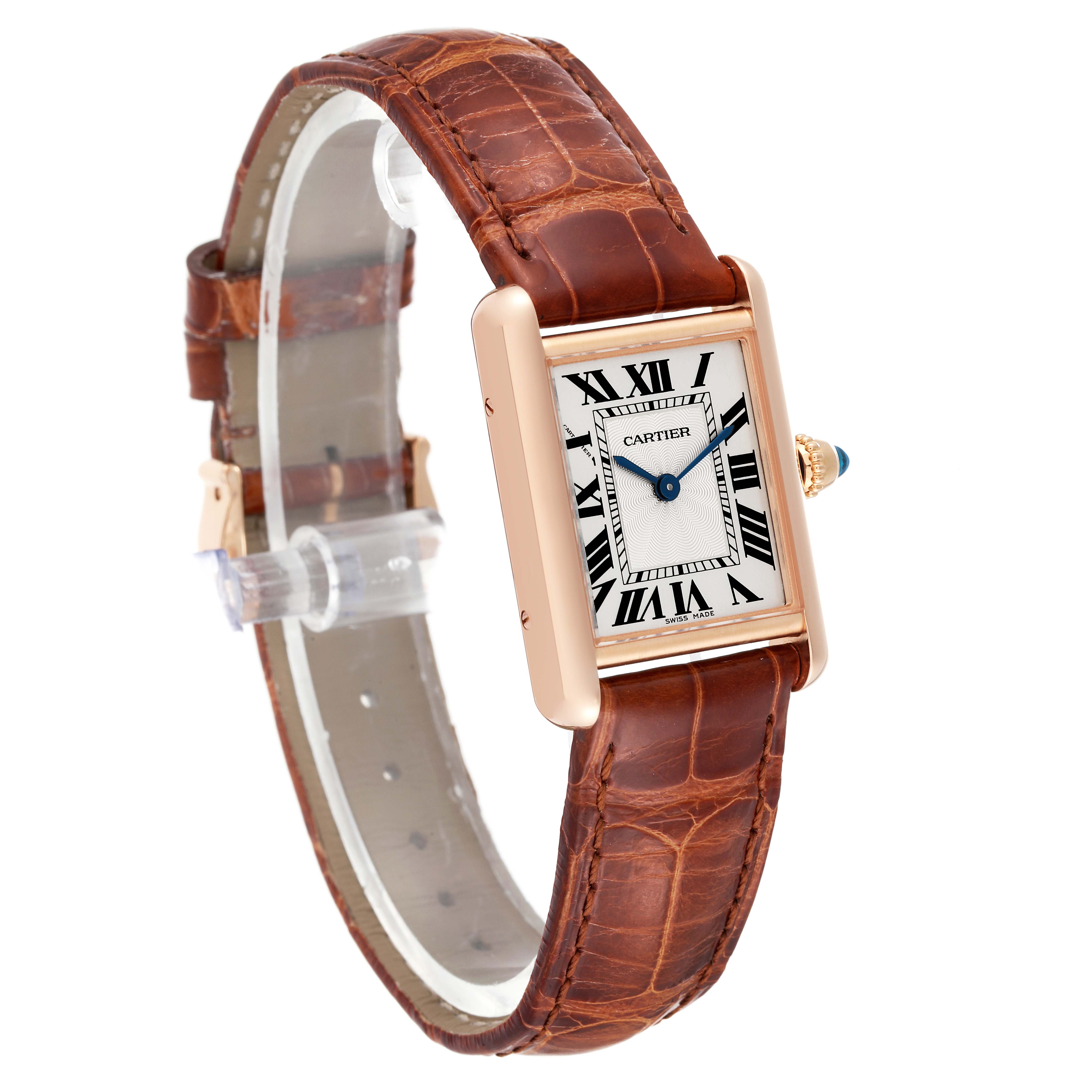 The image shows a diagonal view of a Cartier Tank Louis WGTA0010 Women's Rose Gold Silver Dial WGTA0010 Women's Rose Gold Silver Dial watch, highlighting its brown leather strap and rectangular dial with Roman numerals.