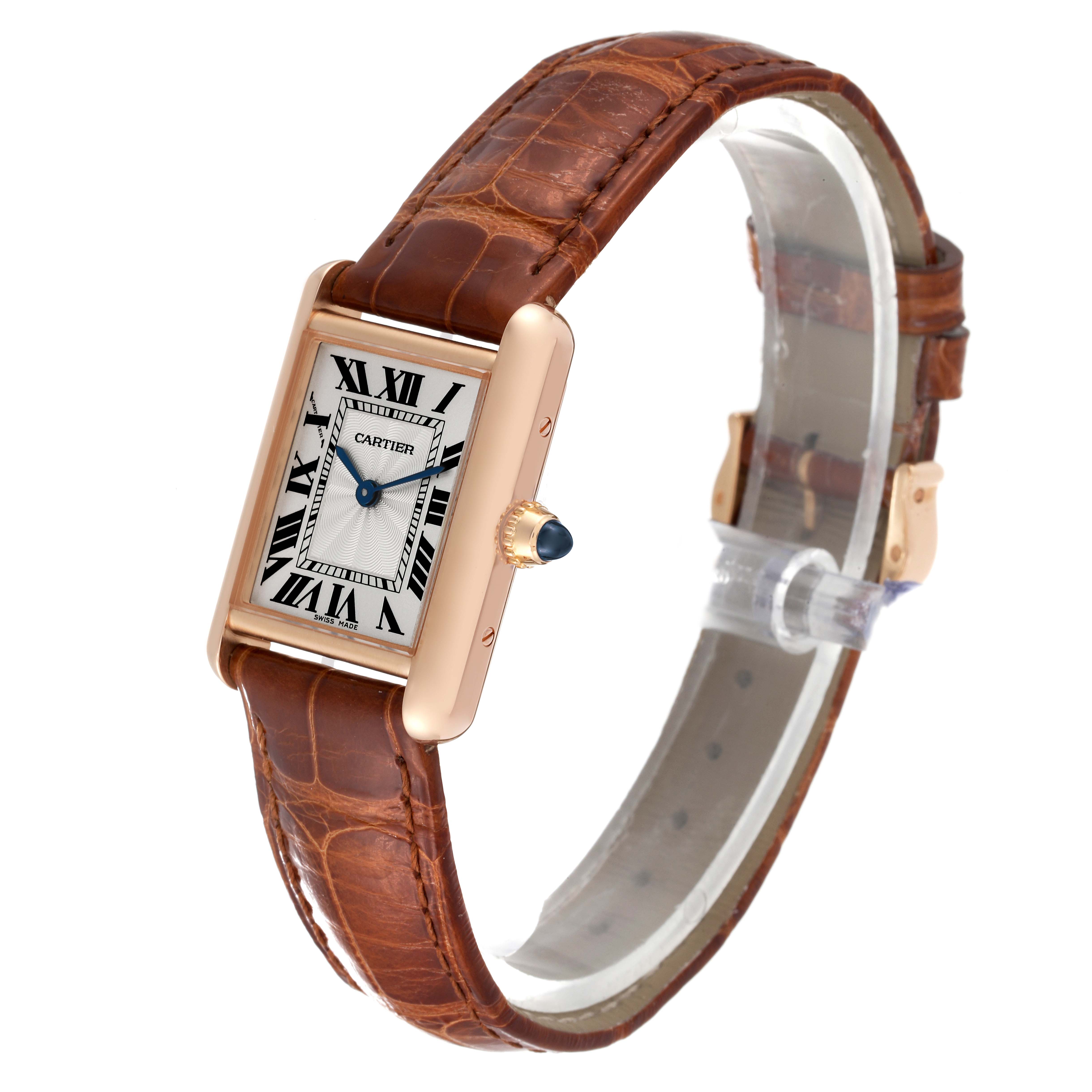 The image shows a Tank Louis Cartier watch at a slight angle, emphasizing its face, strap, and crown.