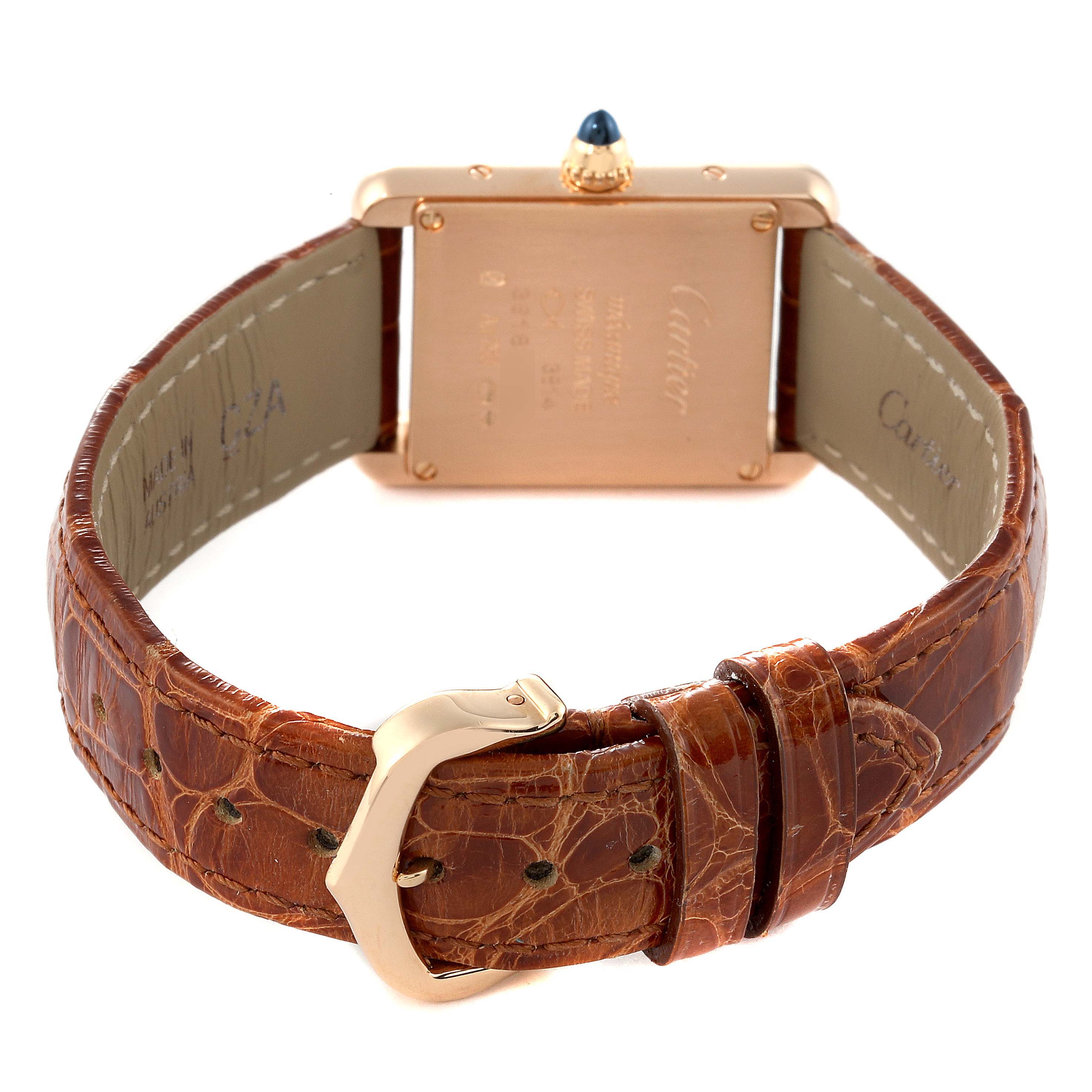 This image shows the rear angle of a Tank Louis watch by Cartier, displaying the case back, crown, and brown leather strap with buckle.