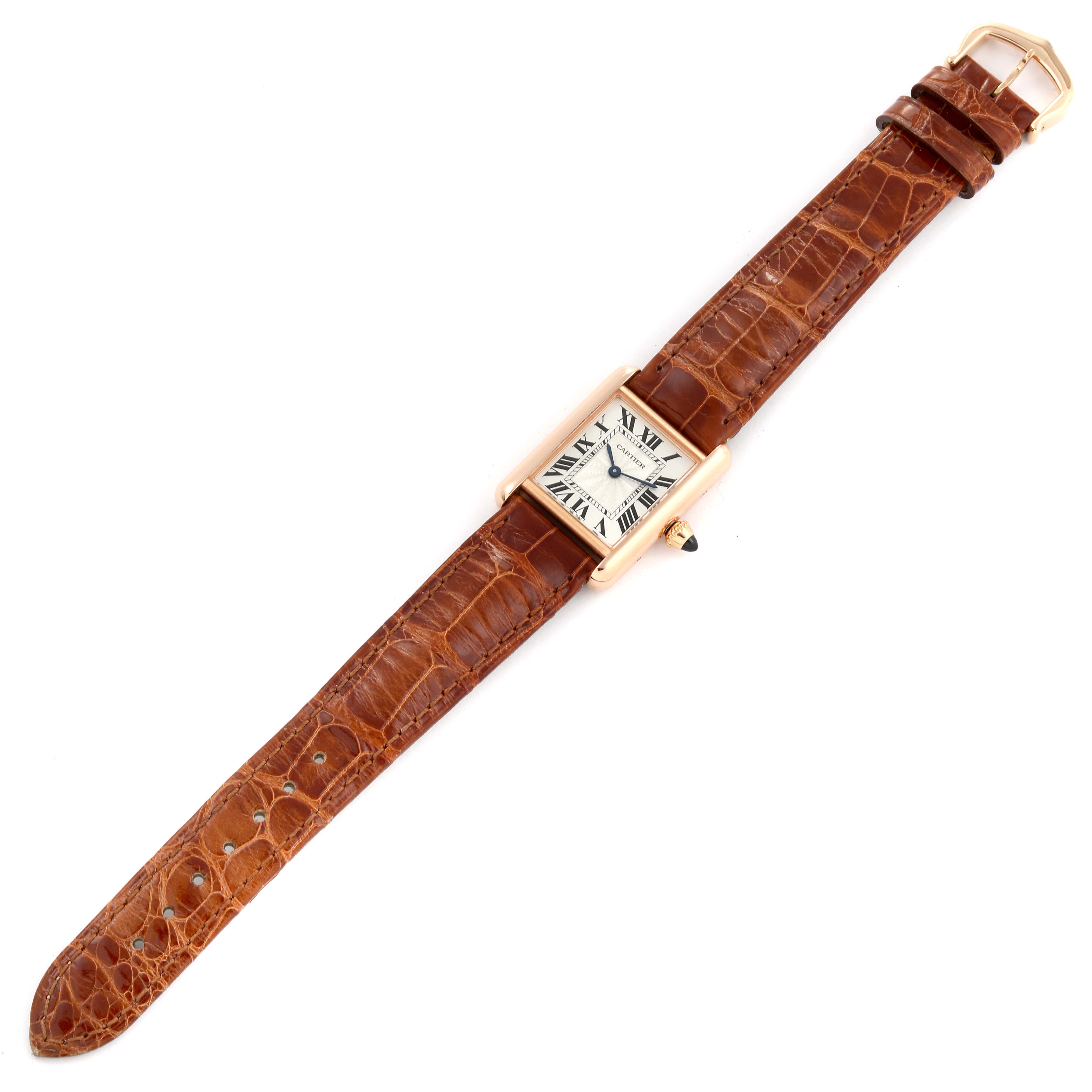 The Cartier Tank Louis WGTA0010 Women's Rose Gold Silver Dial WGTA0010 Women's Rose Gold Silver Dial watch is shown from a top view, displaying the face, leather strap, and buckle.