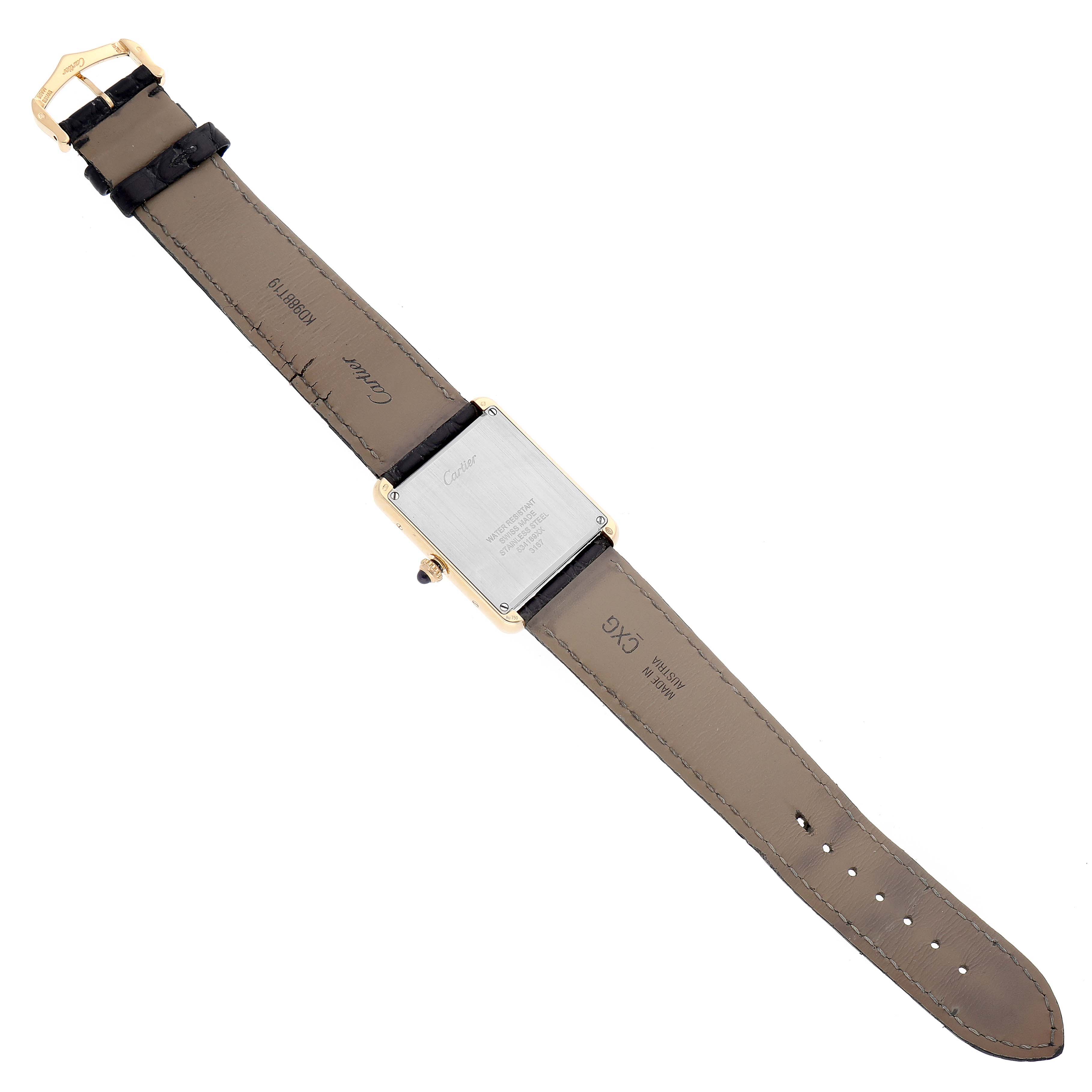 This image shows the back side of a Cartier Tank Solo W5200004 Men
s Steel and Gold (two tone) Silver Dial W5200004 Men
s Steel and Gold (two tone) Silver Dial watch, displaying its leather strap and case back.