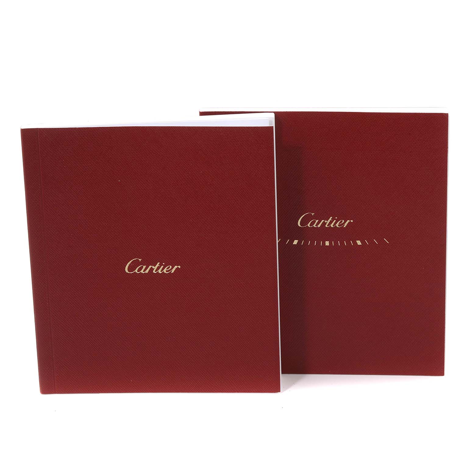 This image shows two red booklets featuring the Cartier logo for the Tank Solo model by Cartier.