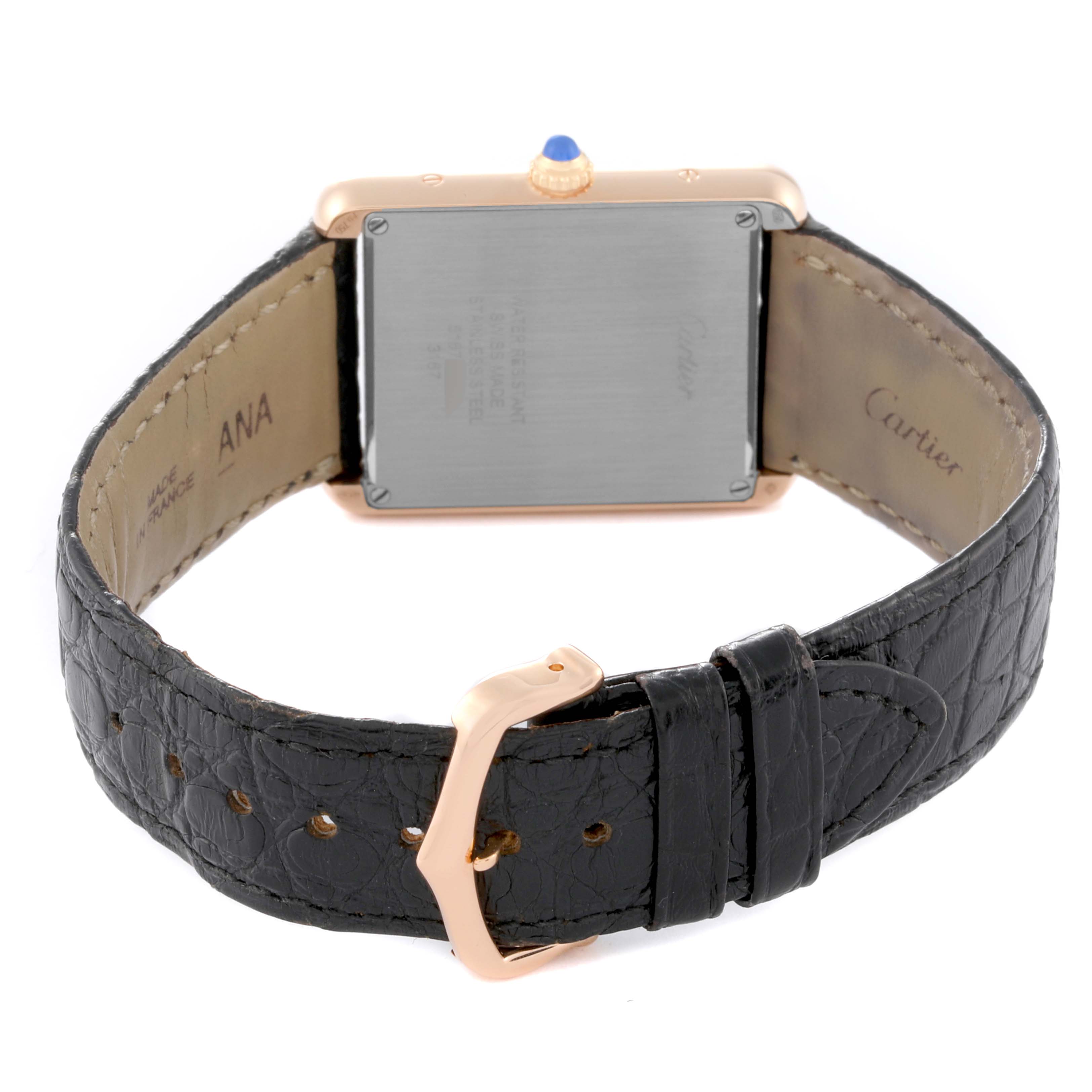 The image shows the back view of a Cartier Tank Solo W5200025 Men's Steel and Gold (two tone) Silver Dial W5200025 Men's Steel and Gold (two tone) Silver Dial watch, highlighting the case back, crown, and black leather strap with a buckle.