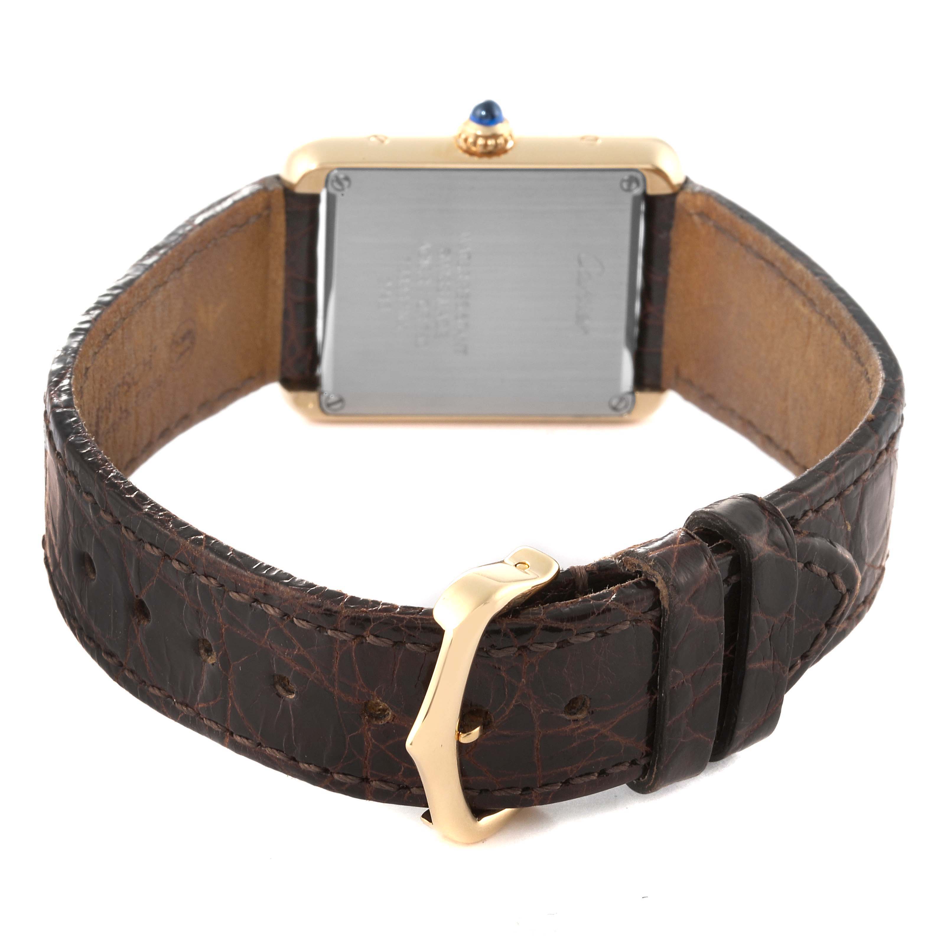 The image shows the back view of the Cartier Tank Solo W1018755 Women
s Steel and Gold (two tone) Silver Dial W1018755 Women
s Steel and Gold (two tone) Silver Dial watch, highlighting its case back, strap, and buckle.