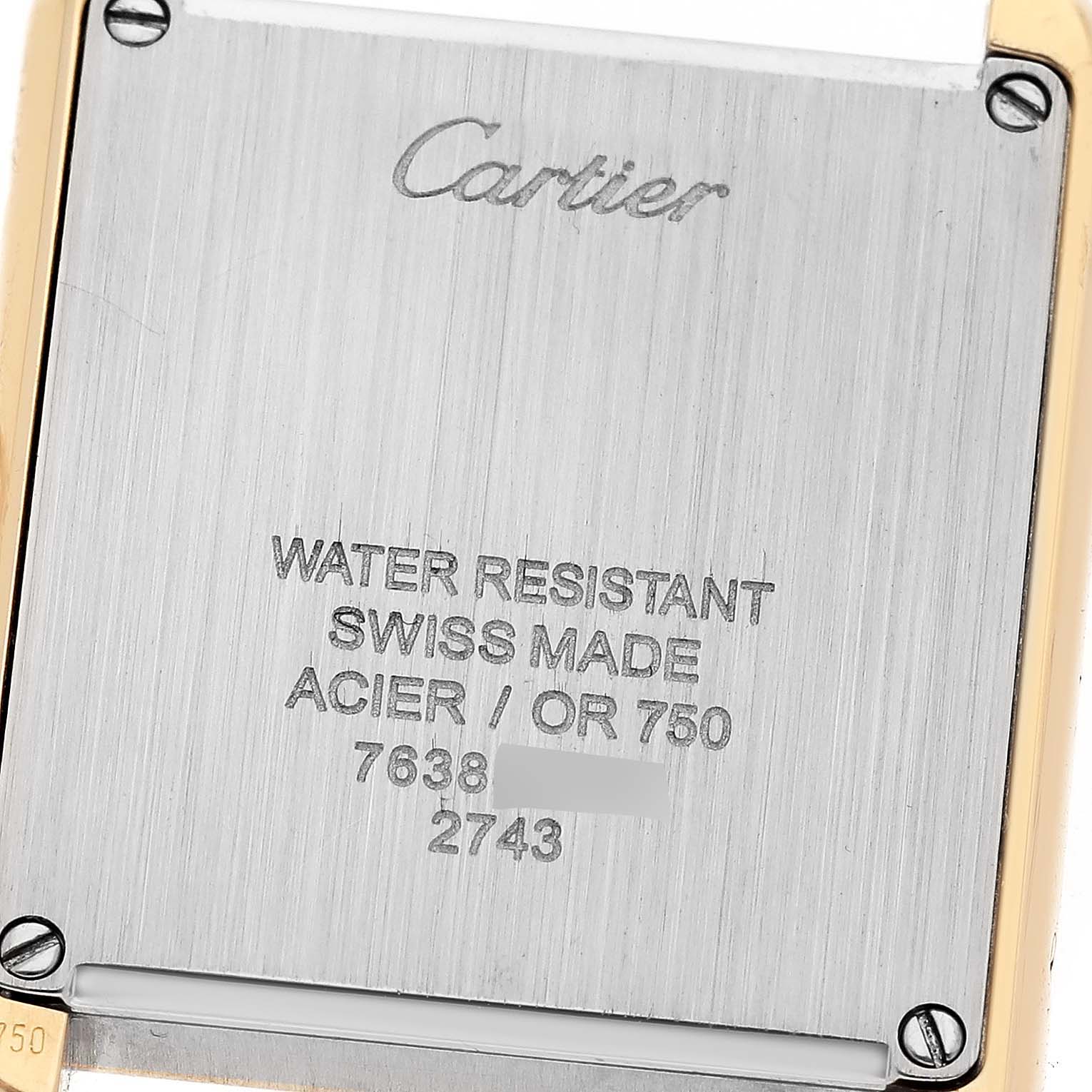 The image shows the back case of a Cartier Tank Solo W1018755 Women
s Steel and Gold (two tone) Silver Dial W1018755 Women
s Steel and Gold (two tone) Silver Dial watch, highlighting the brand engraving and specifications.