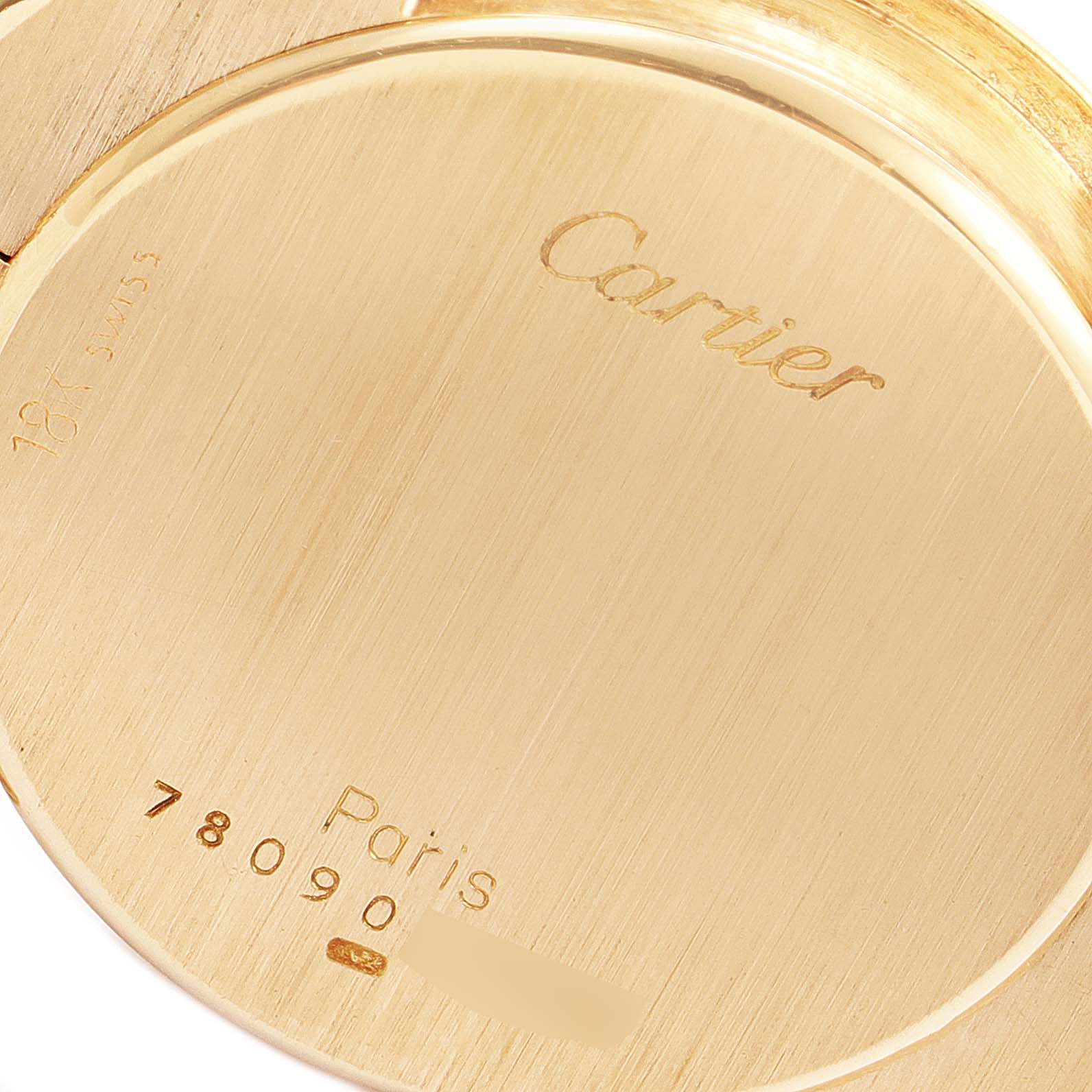 The image shows the back case of a Vendome model watch by Cartier, displaying its markings and serial number.