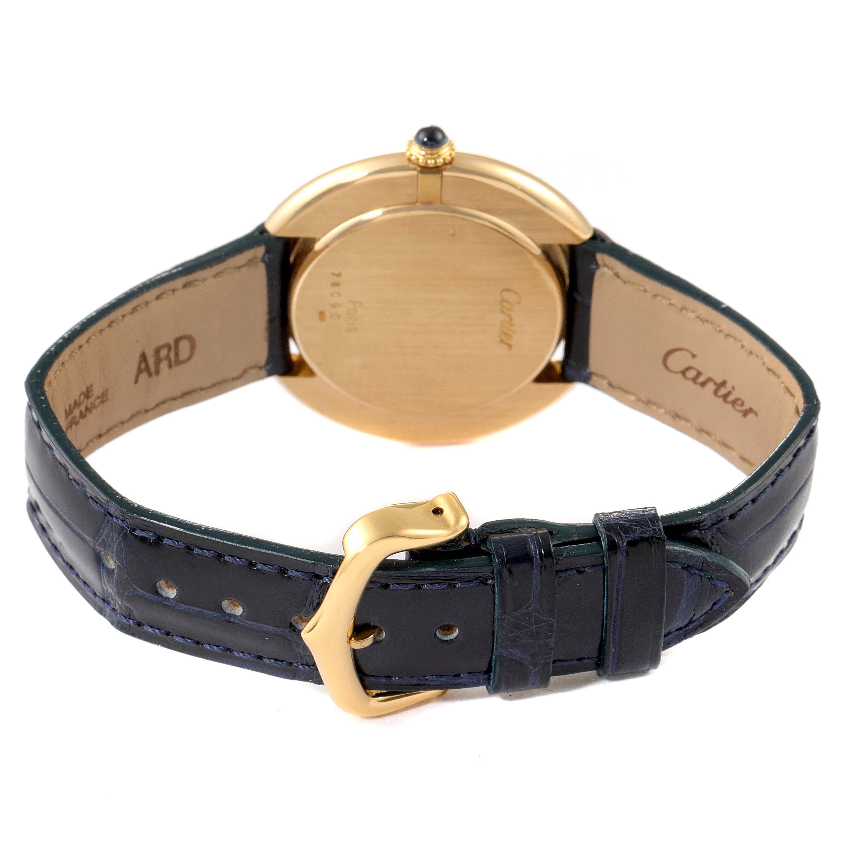 The image shows the back view of a Cartier Vendome Women's Yellow Gold Silver Dial Women's Yellow Gold Silver Dial watch, highlighting the gold case, black leather strap, and buckle.