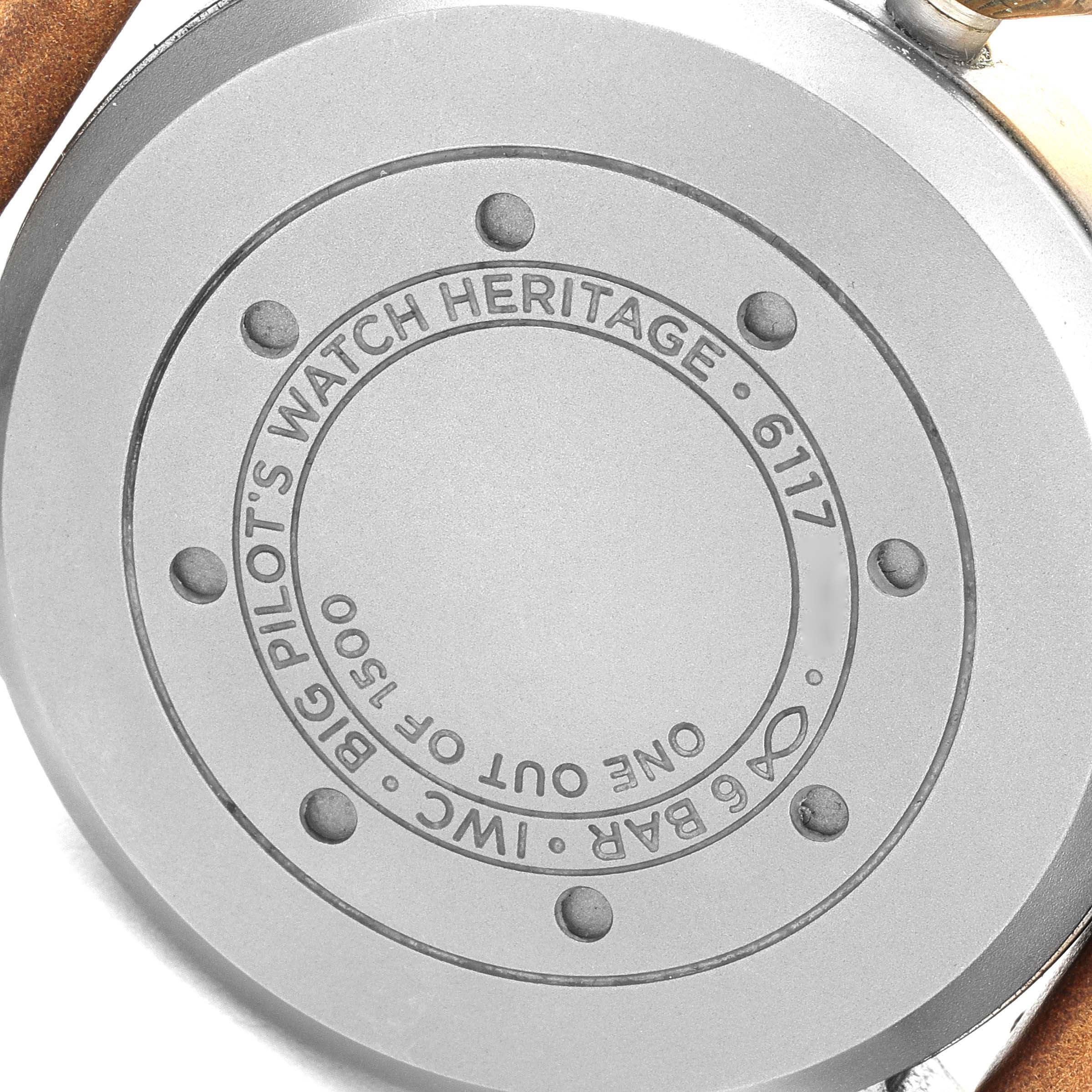 The image shows the back case of an IWC Big Pilot
s Watch Heritage model, displaying the brand engraving and model details.