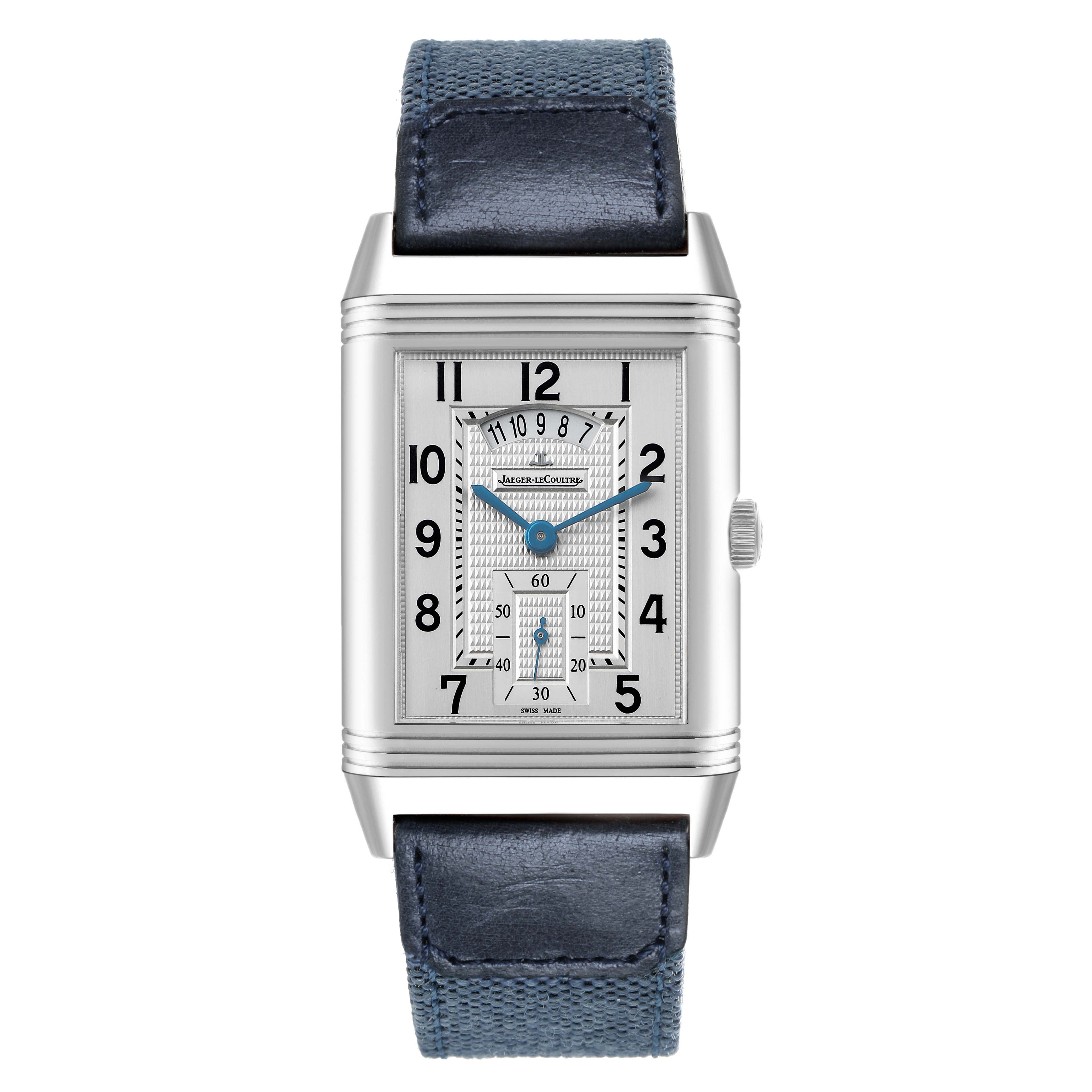 The Jaeger-LeCoultre Reverso watch is shown from a front angle, highlighting its rectangular face, numerals, blue hands, and blue strap.