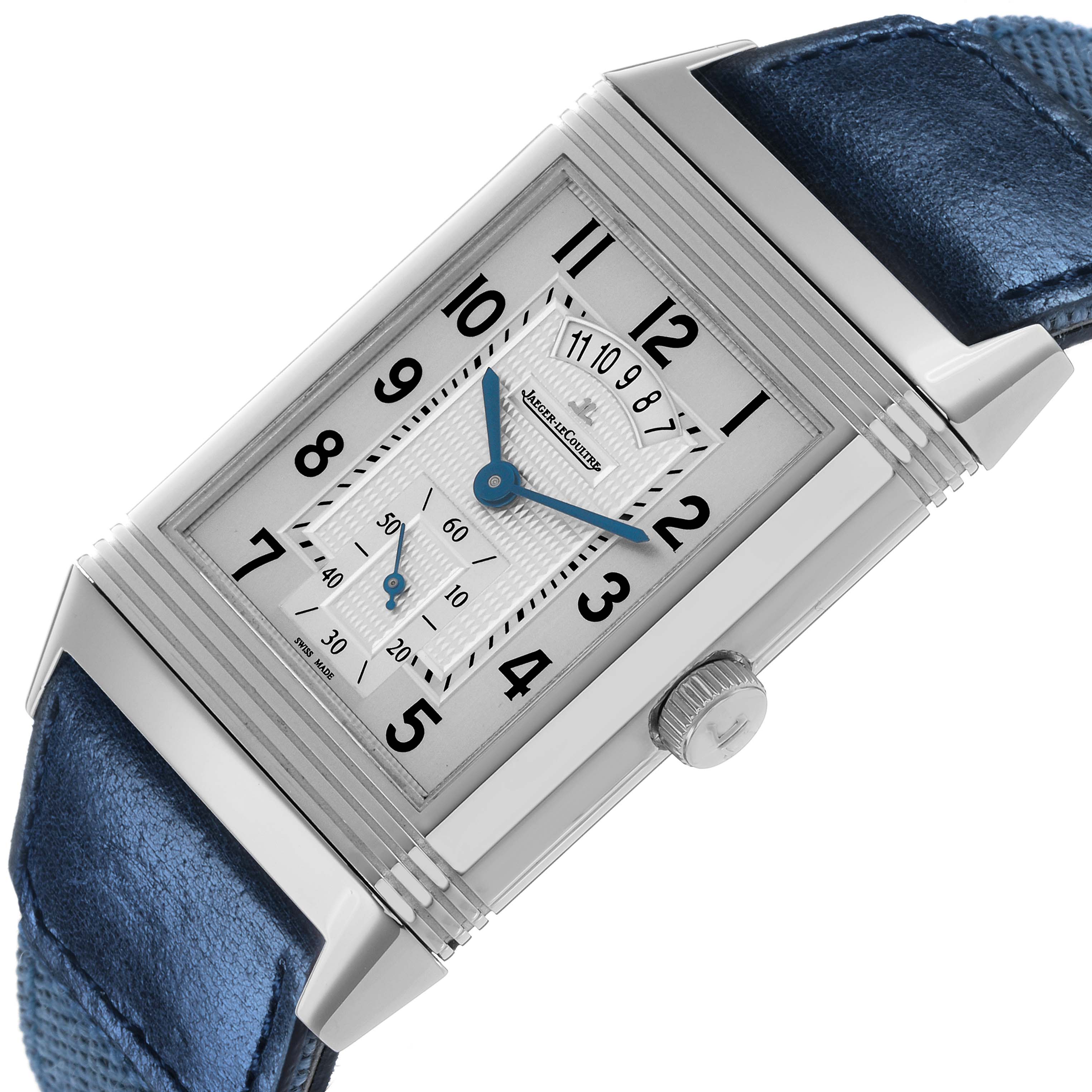 The Jaeger-LeCoultre Reverso watch is shown at an angle displaying the rectangular face, crown, and partial strap.