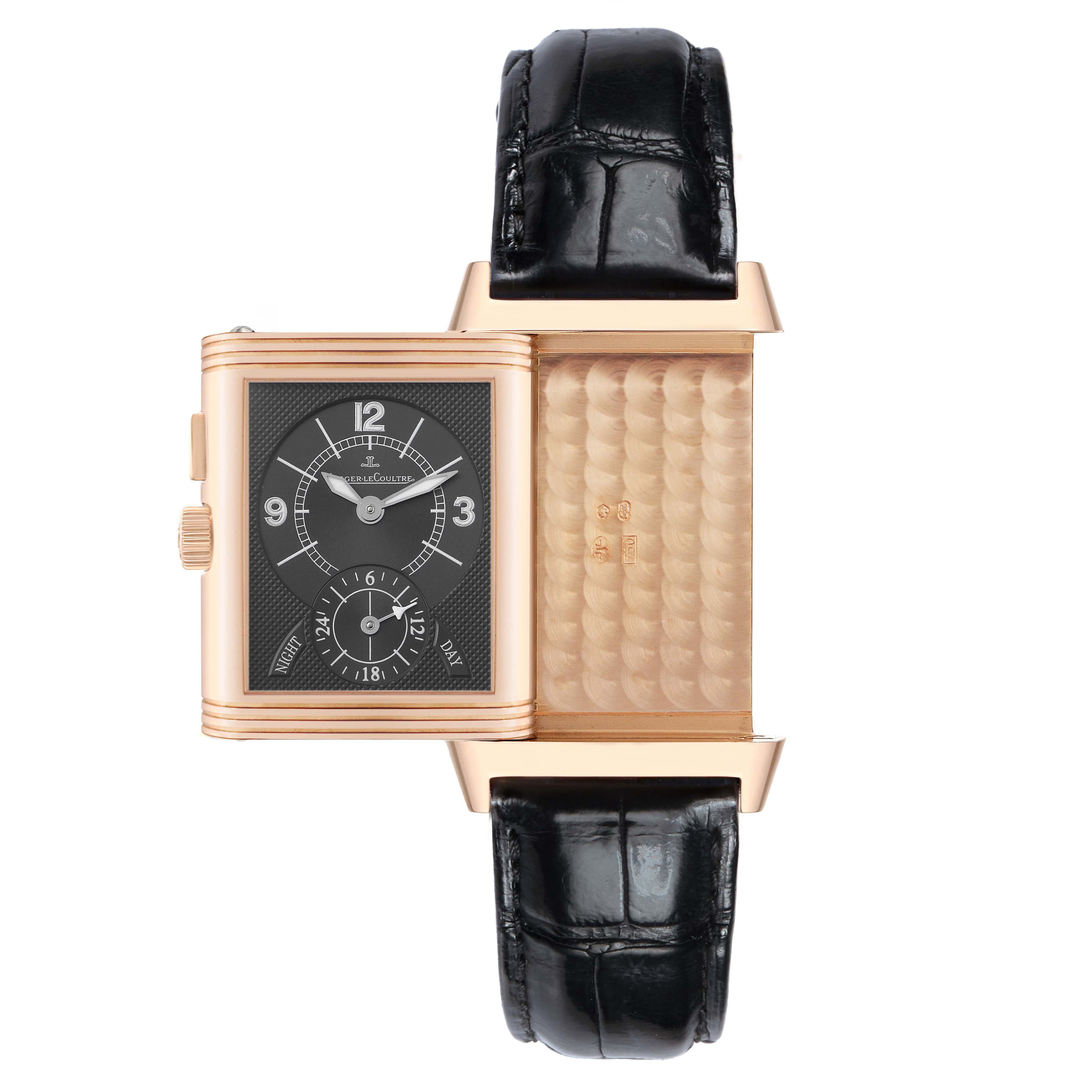 The Jaeger-LeCoultre Reverso watch is shown with its case swiveled open, displaying both the watch face and the inner back panel.