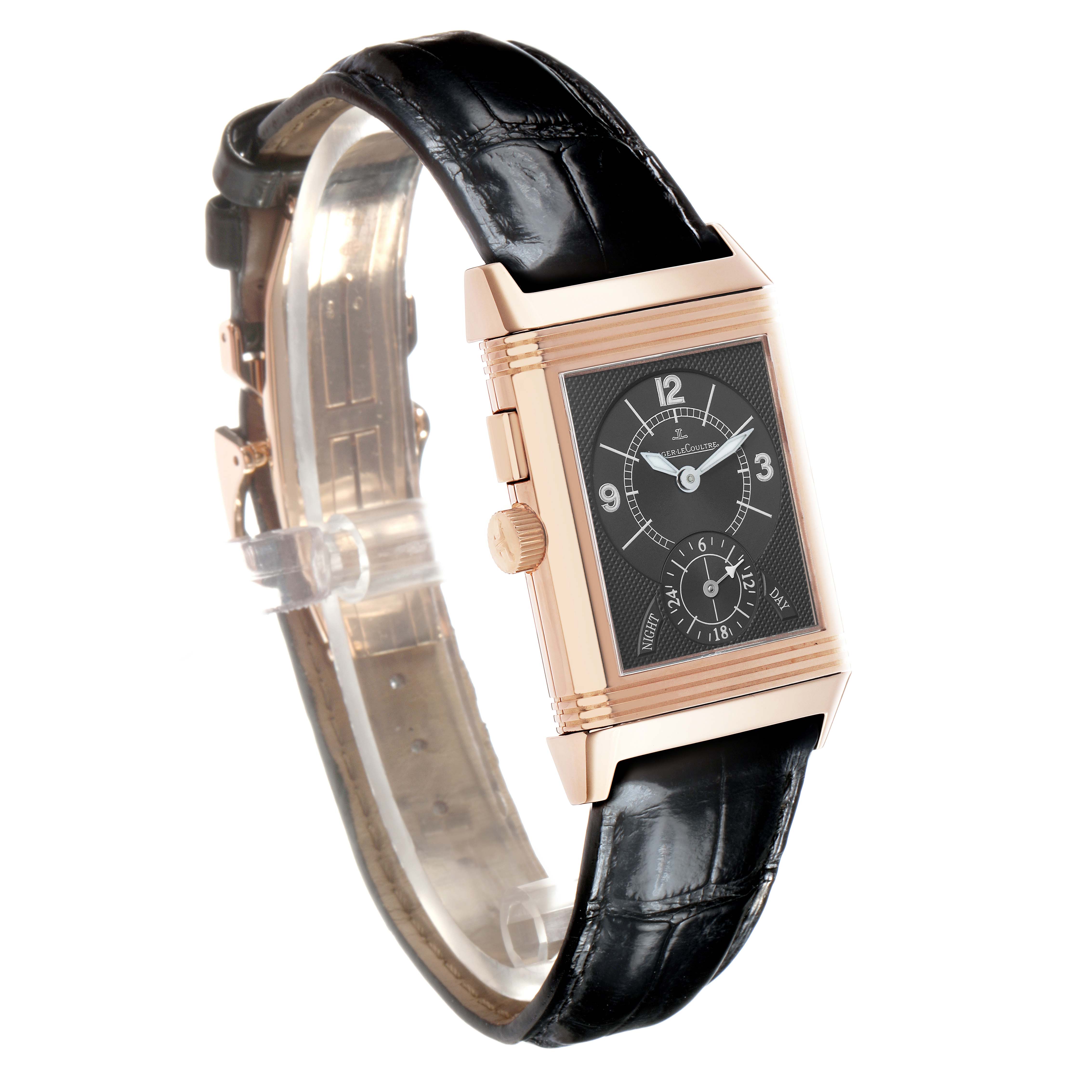 The Jaeger-LeCoultre Reverso watch is shown at a slight angle, highlighting the front face, crown, and alligator strap.