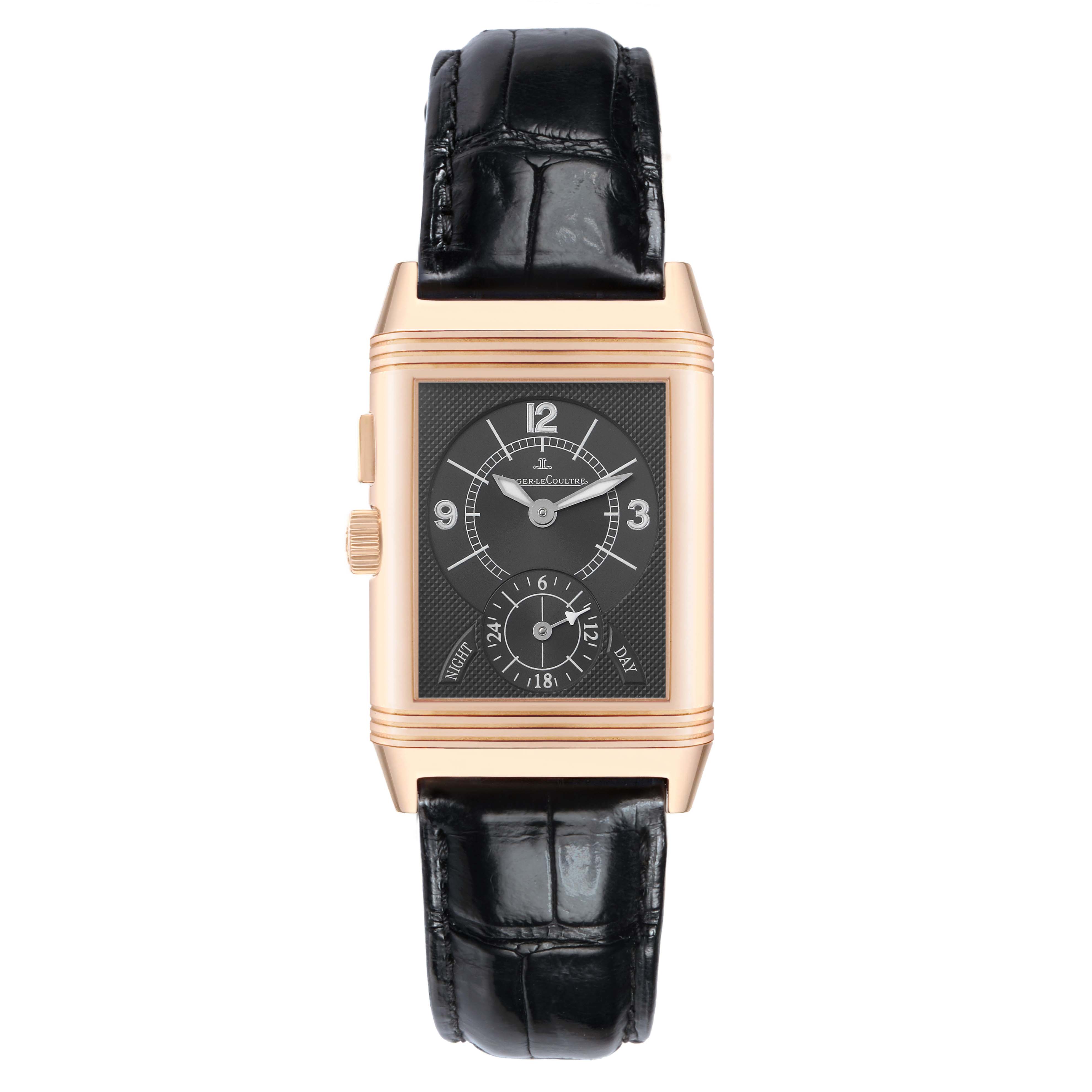The Jaeger-LeCoultre Reverso watch is shown from a front angle, highlighting the dial, case, crown, and leather strap.