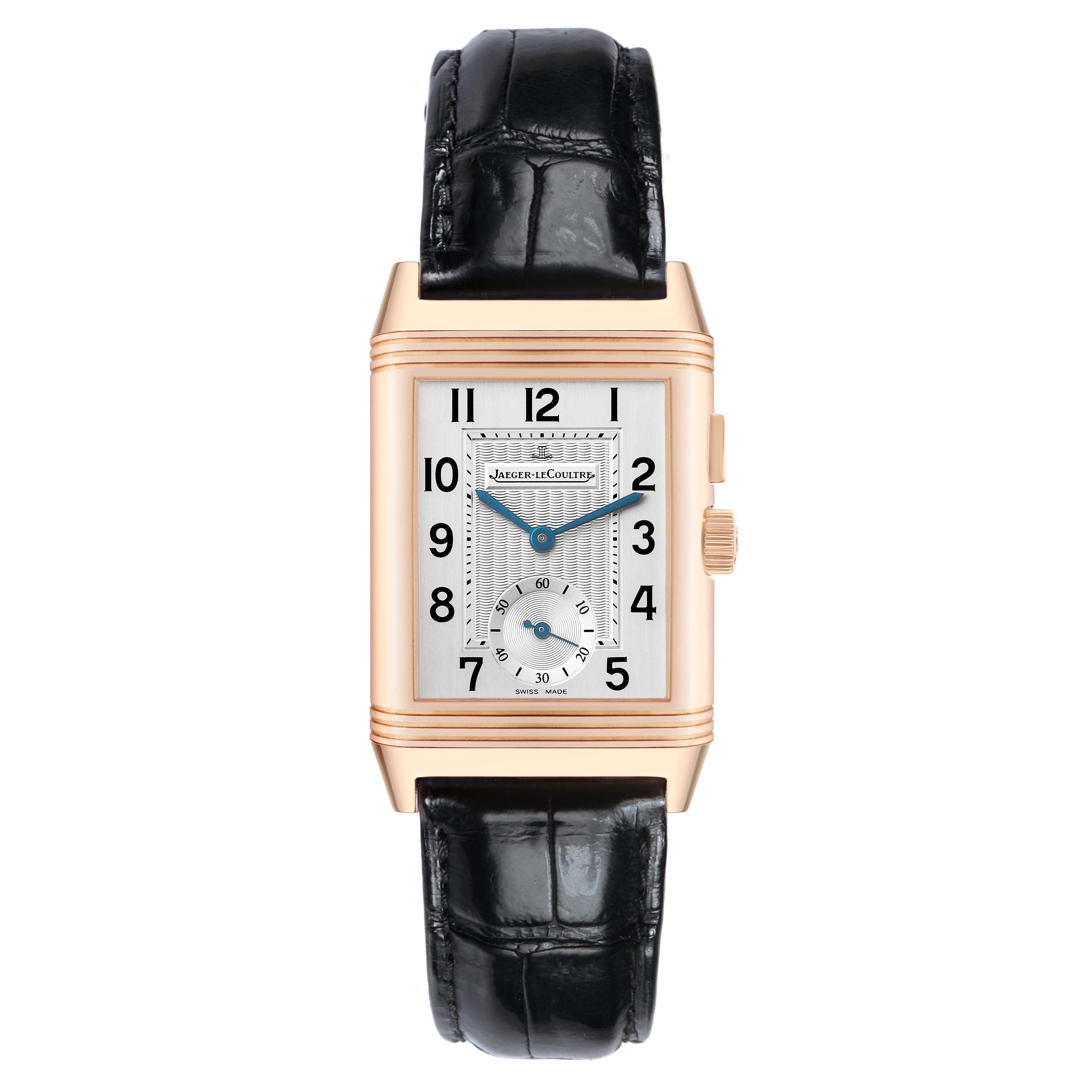 The Jaeger-LeCoultre Reverso watch is shown from the front, highlighting its rectangular face and black leather strap.