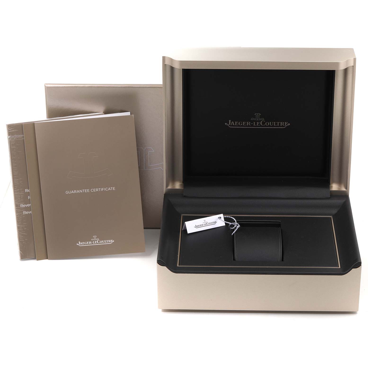 The image shows the open box, guarantee certificate, and accessories for the Jaeger-LeCoultre Reverso model.