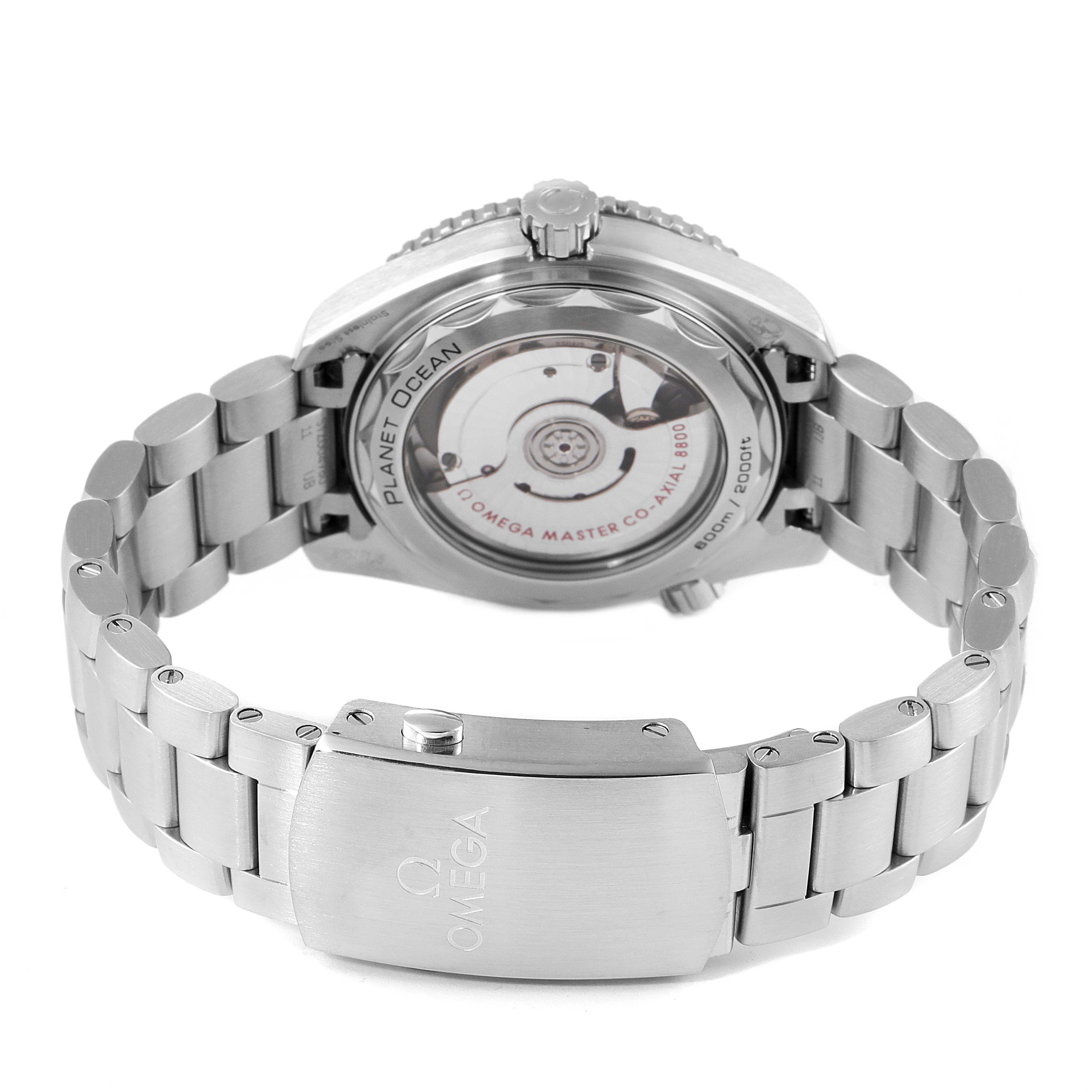 The image shows the back view of the Omega Planet Ocean 215.30.40.20.03.001 Men
s Stainless Steel Blue Dial 215.30.40.20.03.001 Men
s Stainless Steel Blue Dial watch, focusing on the bracelet and the transparent case back.