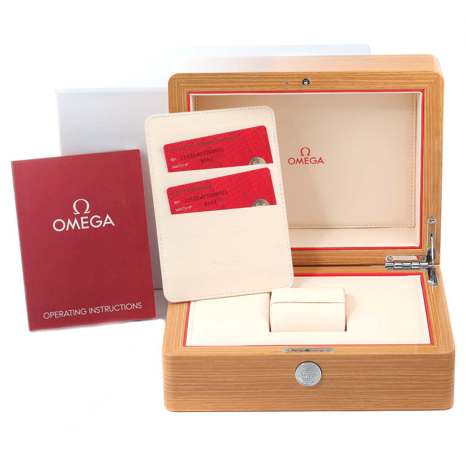 The image shows the packaging and accessories for an Omega Planet Ocean 215.30.40.20.03.001 Men
s Stainless Steel Blue Dial 215.30.40.20.03.001 Men
s Stainless Steel Blue Dial watch, including a wooden box, warranty cards, and an instruction booklet.