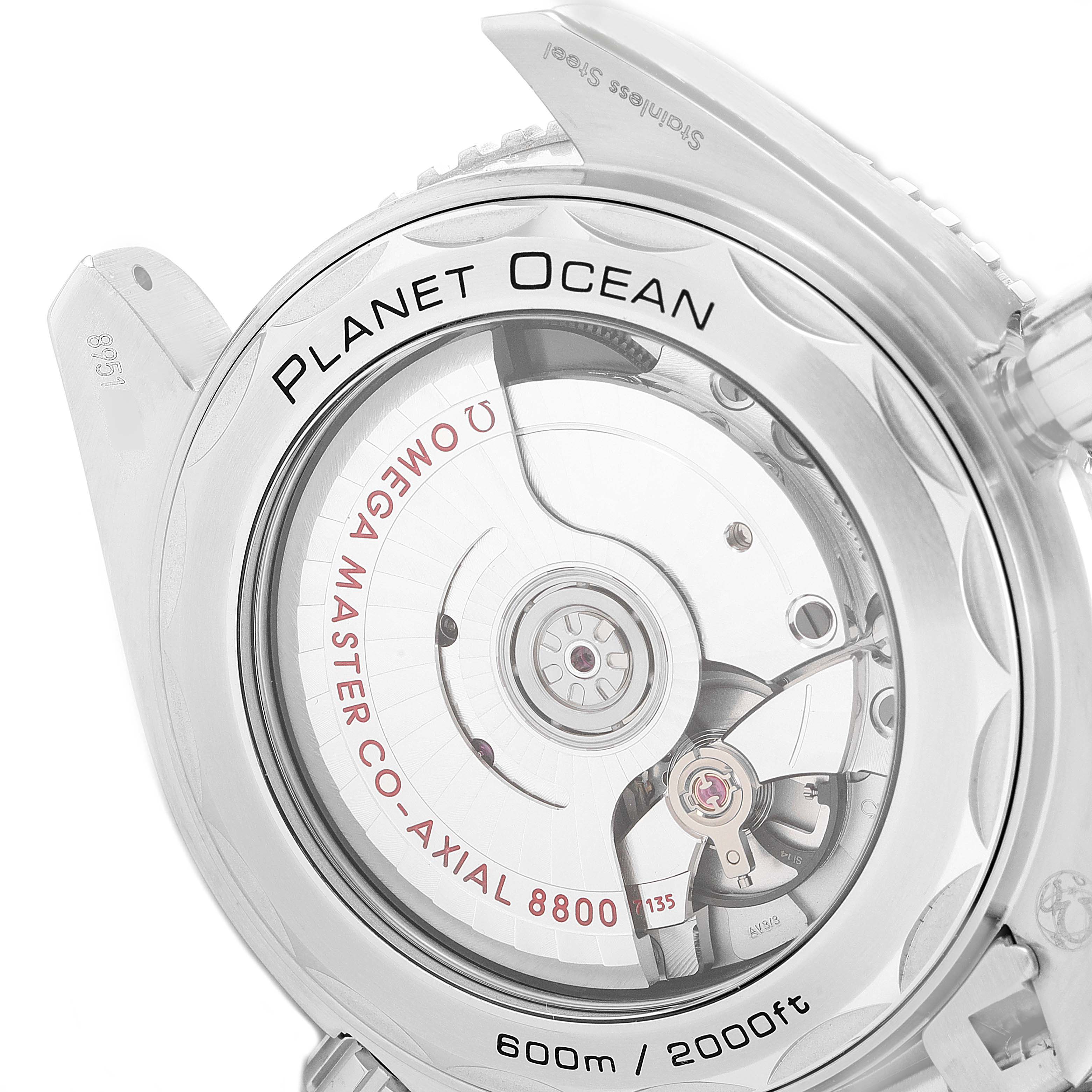 The image shows a close-up view of the back of the Omega Planet Ocean 215.30.40.20.03.001 Men
s Stainless Steel Blue Dial 215.30.40.20.03.001 Men
s Stainless Steel Blue Dial watch, highlighting the Omega Master Co-Axial 8800 movement.