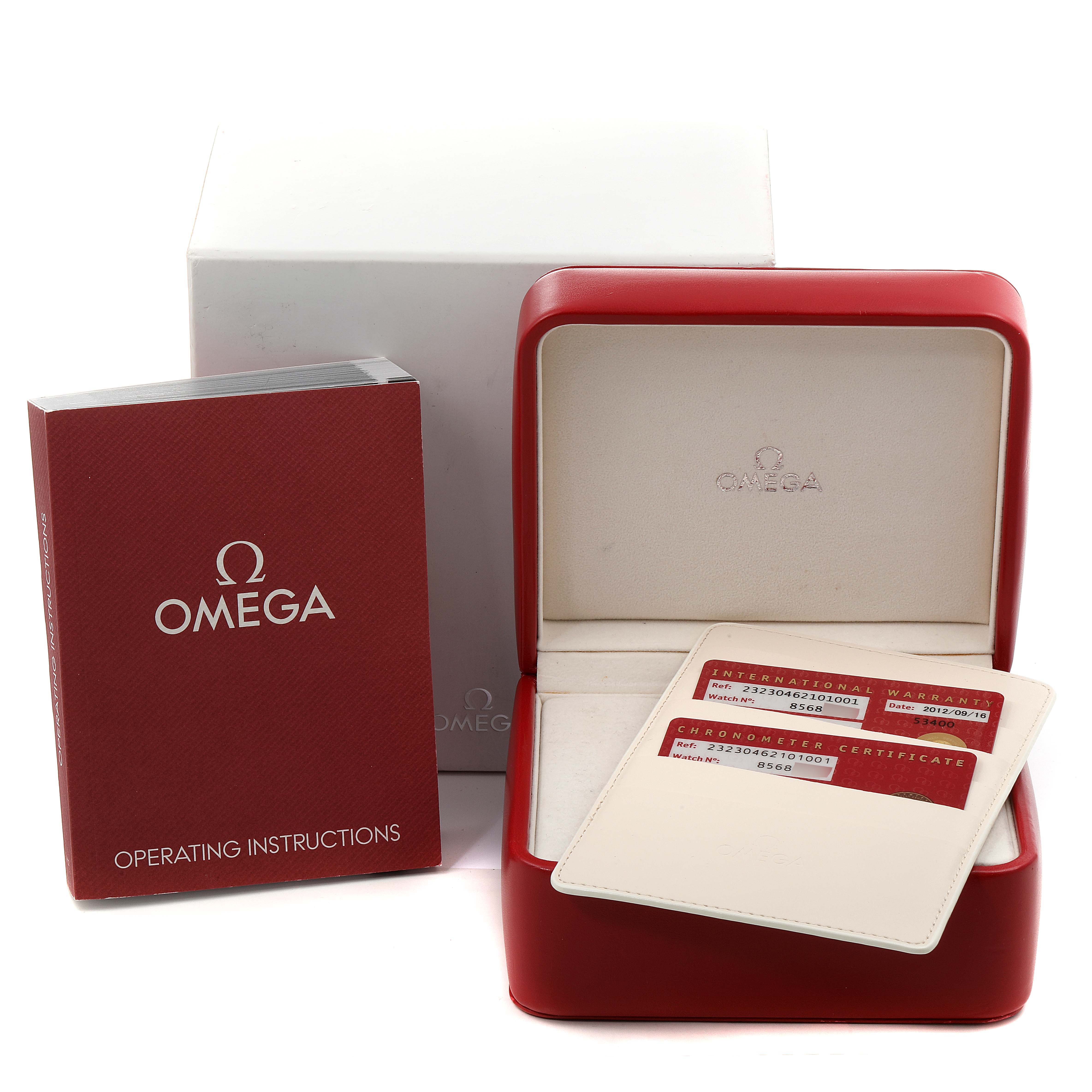 The image shows the packaging of the Omega Planet Ocean 232.30.46.21.01.001 Men's Stainless Steel Black Dial 232.30.46.21.01.001 Men's Stainless Steel Black Dial watch, including the red watch box, warranty cards, and an operating instructions booklet.