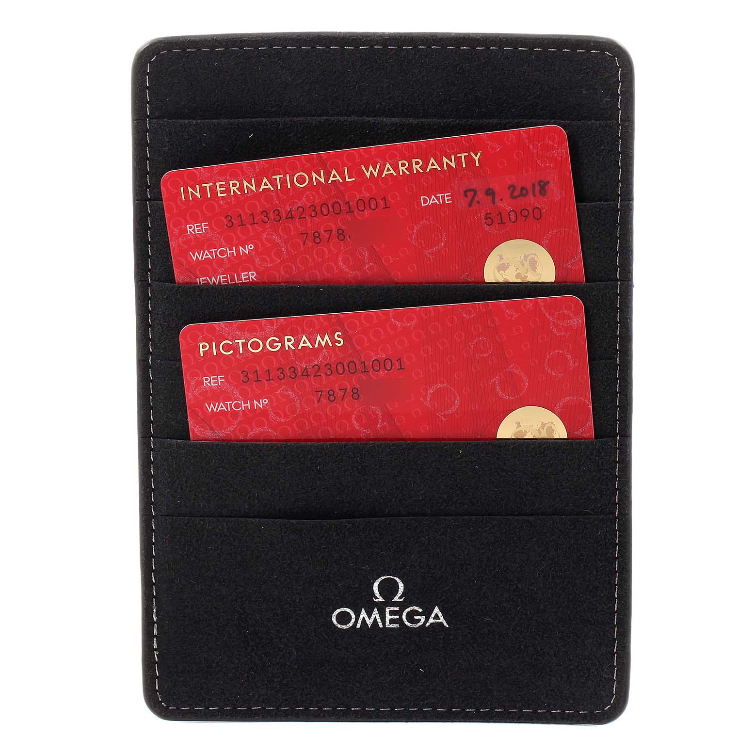 The image shows the warranty and pictogram cards for the Omega Speedmaster 311.33.42.30.01.001 Men's Stainless Steel Black Dial 311.33.42.30.01.001 Men's Stainless Steel Black Dial model, inside a black case with the Omega logo.