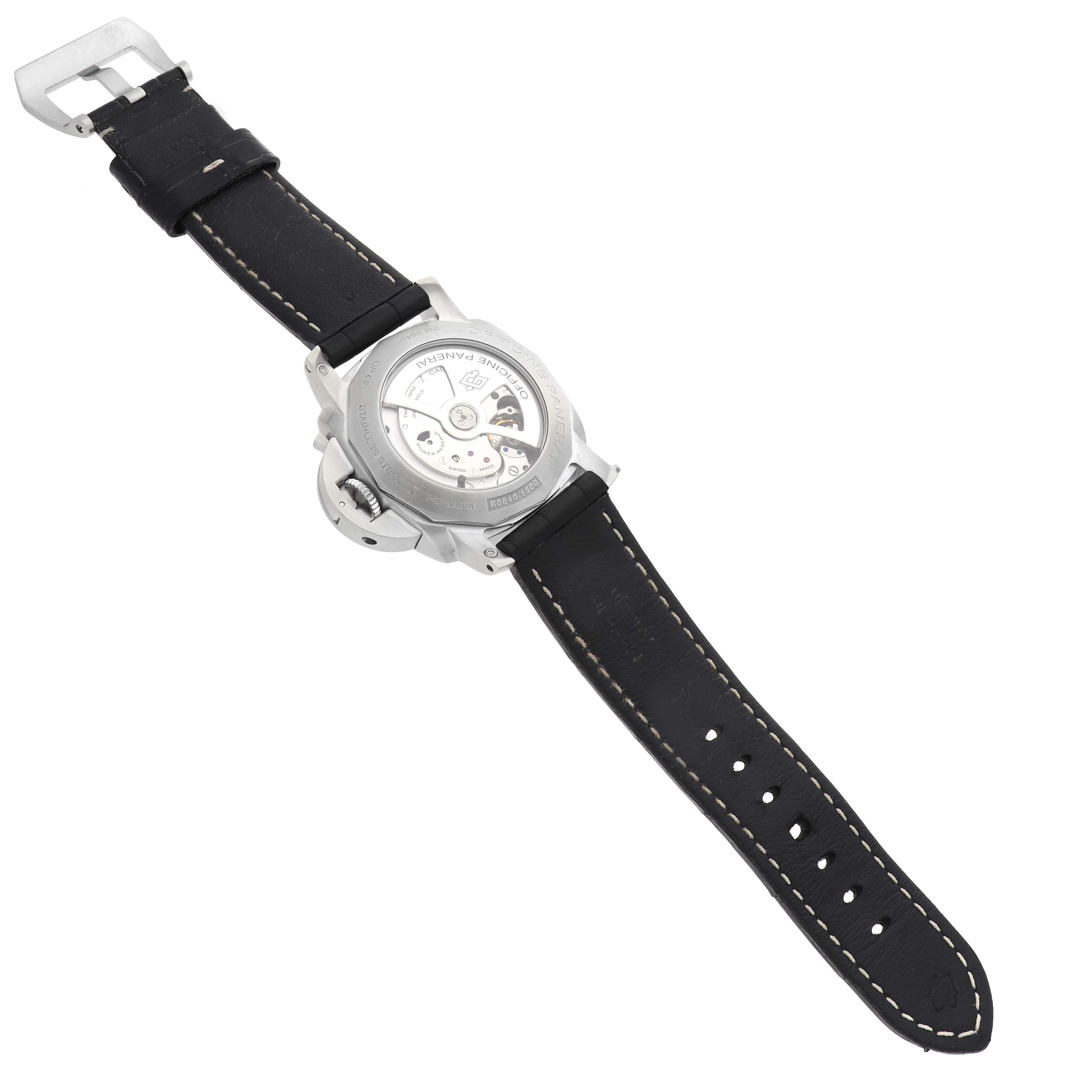 The Panerai Luminor PAM00320 Men's Stainless Steel Black Dial watch is shown from the back, displaying its movement and black leather strap.