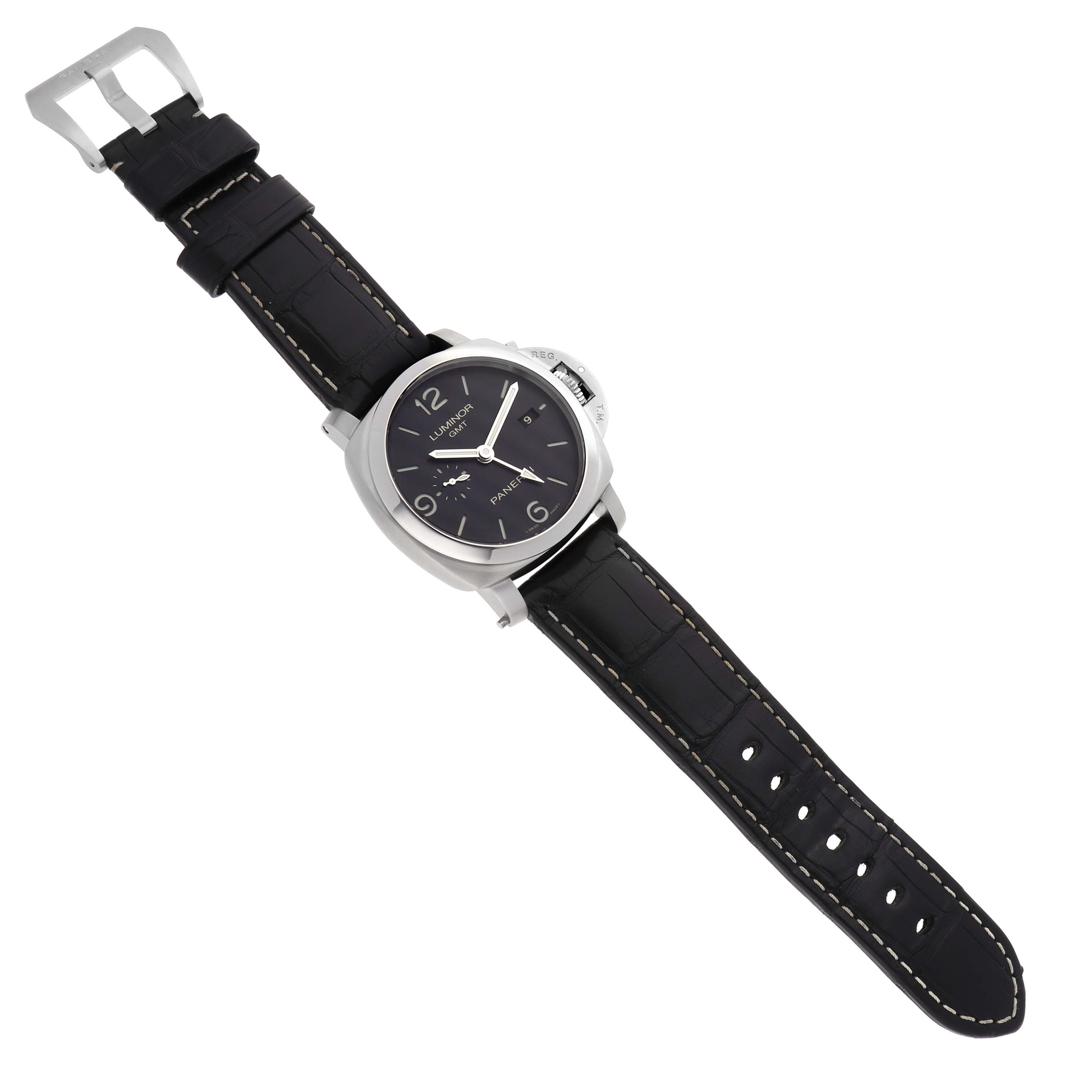 The Panerai Luminor PAM00320 Men's Stainless Steel Black Dial watch is shown from a top-down angle, highlighting the face, case, and black strap with buckle.