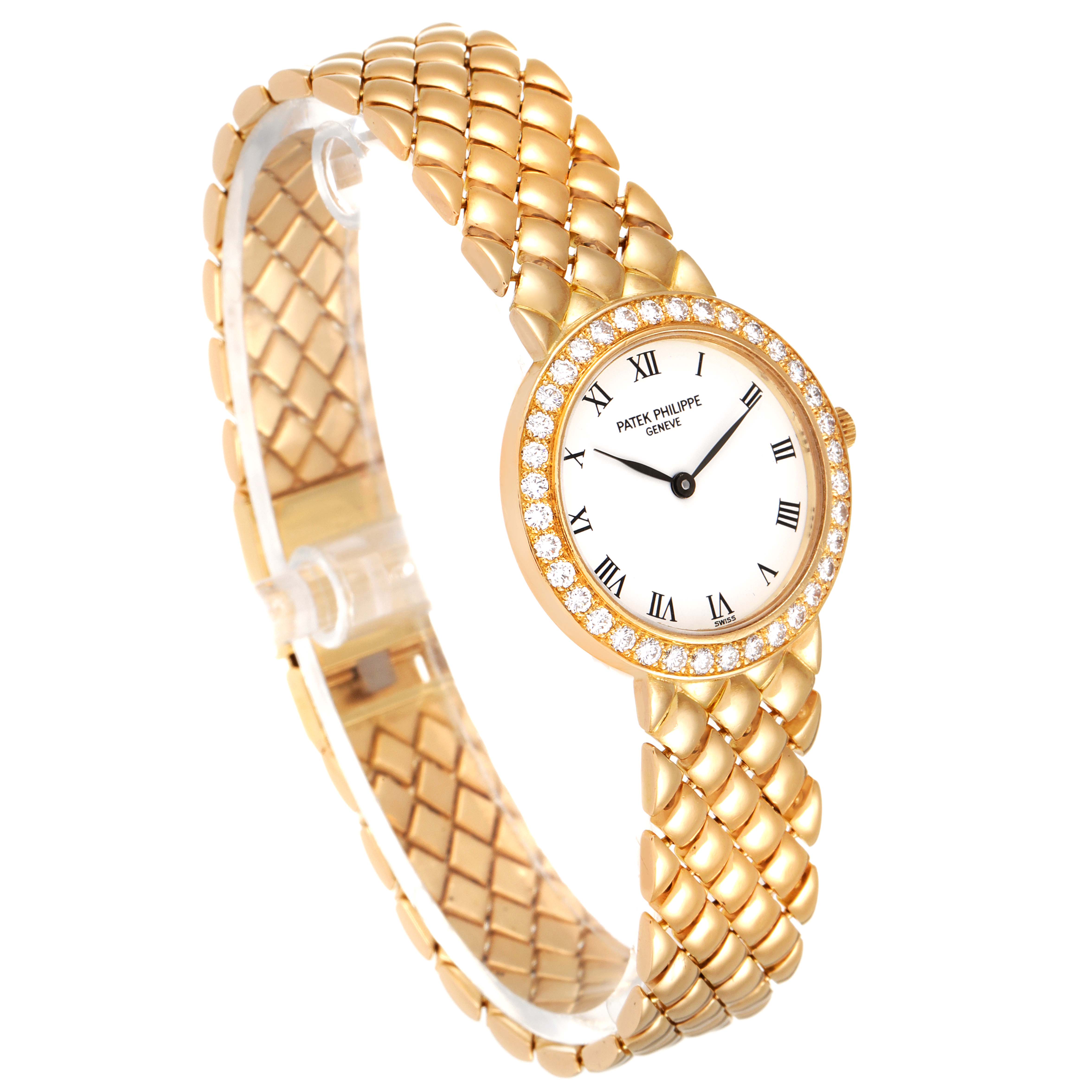 This image shows a Patek Philippe Calatrava 4820 Women's Yellow Gold White Dial 4820 Women's Yellow Gold White Dial watch from an angled view, highlighting its gold bracelet and diamond-studded bezel.