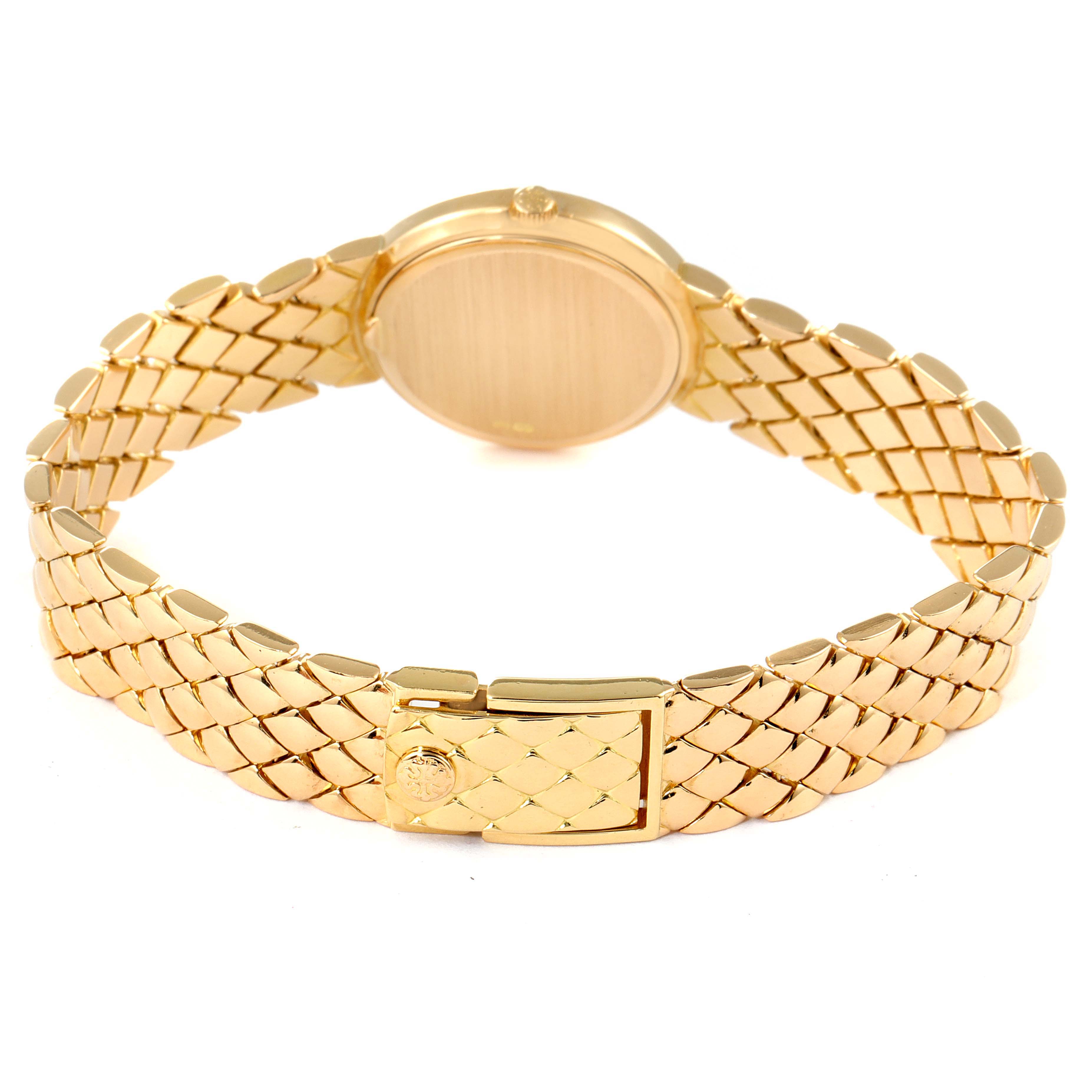 The image shows a Patek Philippe Calatrava 4820 Women's Yellow Gold White Dial 4820 Women's Yellow Gold White Dial watch from a rear angle, featuring its gold band and closed clasp.