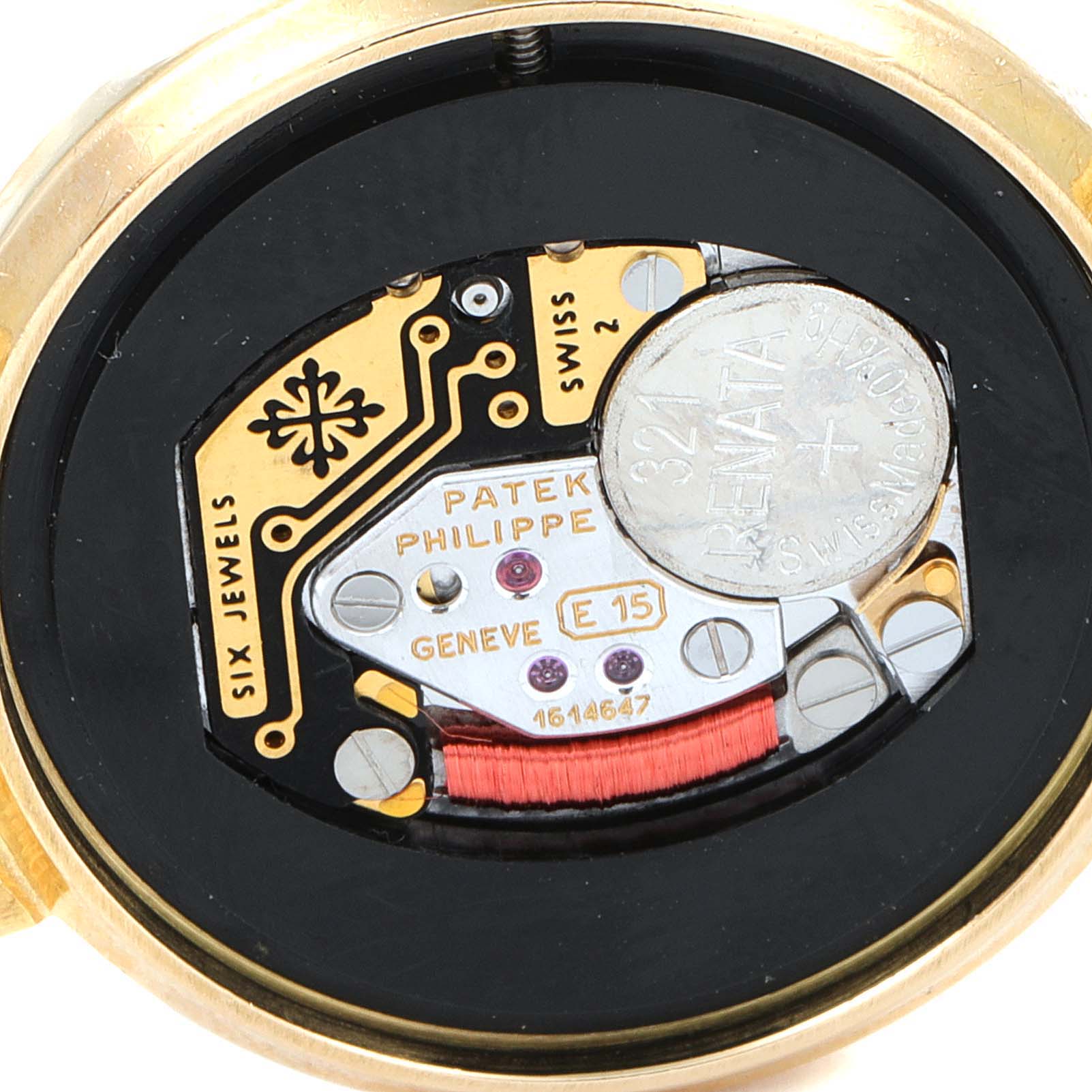 The image shows the back casing and internal mechanism of a Patek Philippe Calatrava 4820 Women's Yellow Gold White Dial 4820 Women's Yellow Gold White Dial watch, focusing on the electronic components and battery.