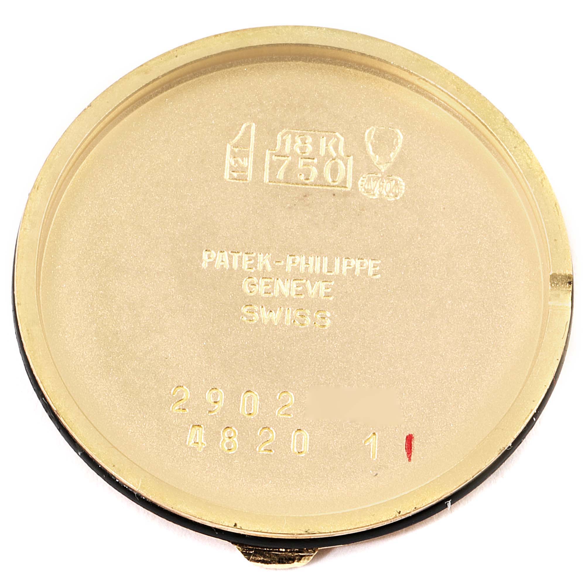 The image shows the inside of the case back for a Patek Philippe Calatrava 4820 Women's Yellow Gold White Dial 4820 Women's Yellow Gold White Dial watch, with markings indicating 18K gold.