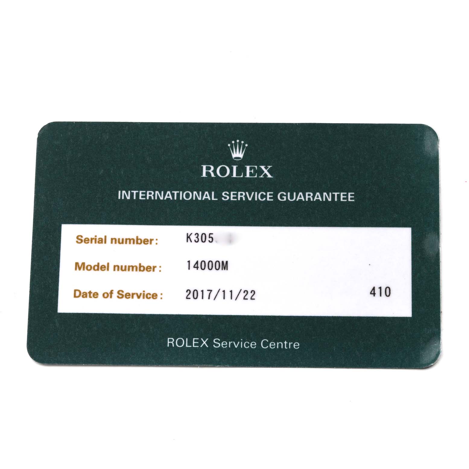 This image shows an international service guarantee card for a Rolex Air-King 14000M Men's Stainless Steel Blue Dial 14000M Men's Stainless Steel Blue Dial model with a serial number and service date.