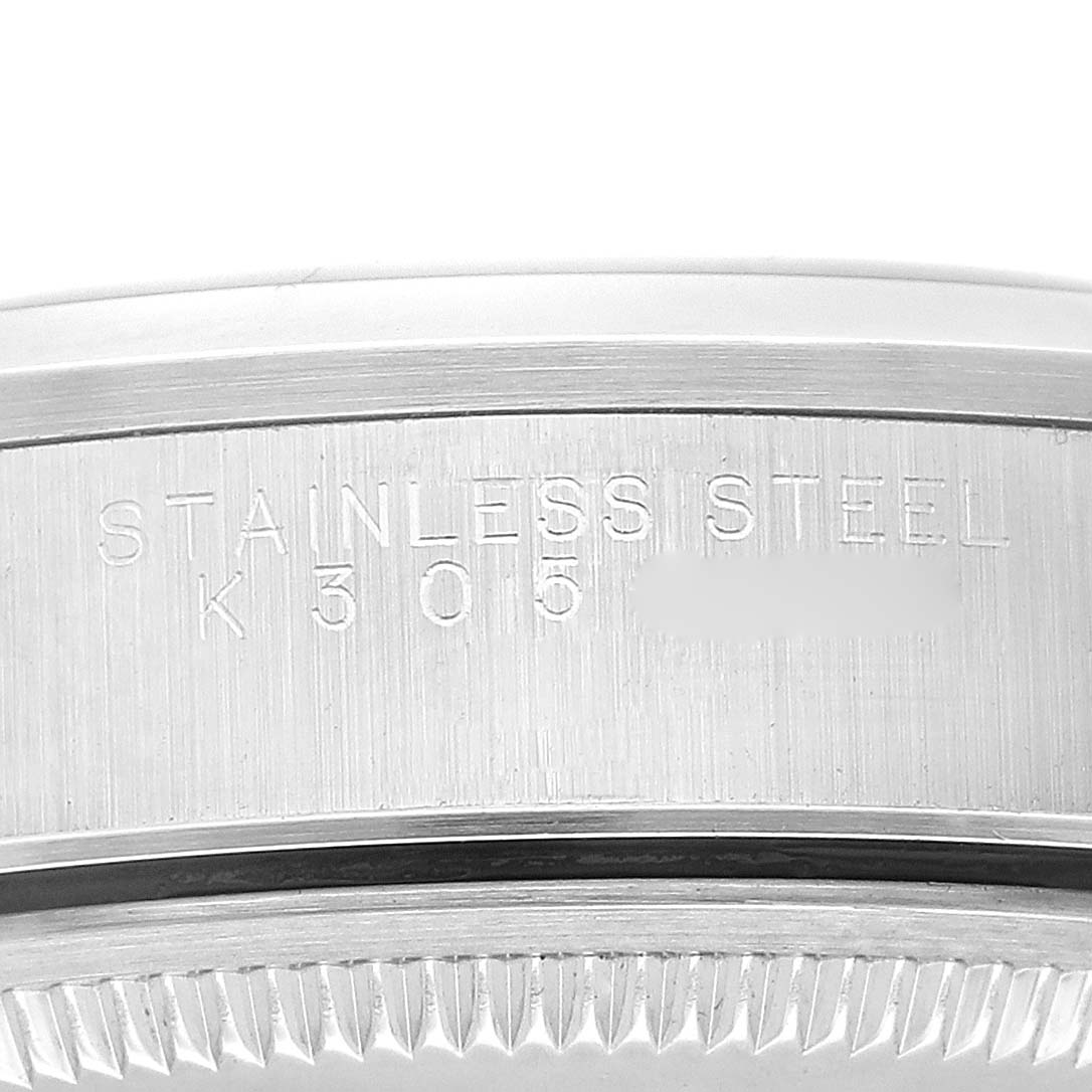 The image shows a close-up of the stainless steel case back with engravings of the Rolex Air-King 14000M Men's Stainless Steel Blue Dial 14000M Men's Stainless Steel Blue Dial watch model.