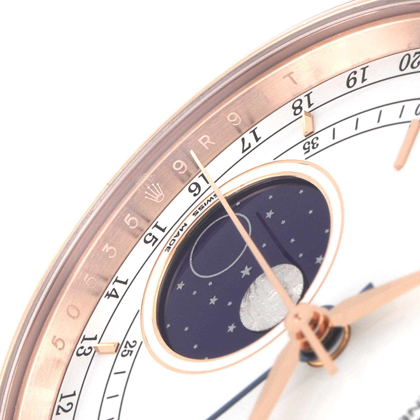This image shows a close-up angle of the Rolex Cellini 50535 Men's Rose Gold White Dial 50535 Men's Rose Gold White Dial watch's face, highlighting its moon phase indicator and part of its date display.