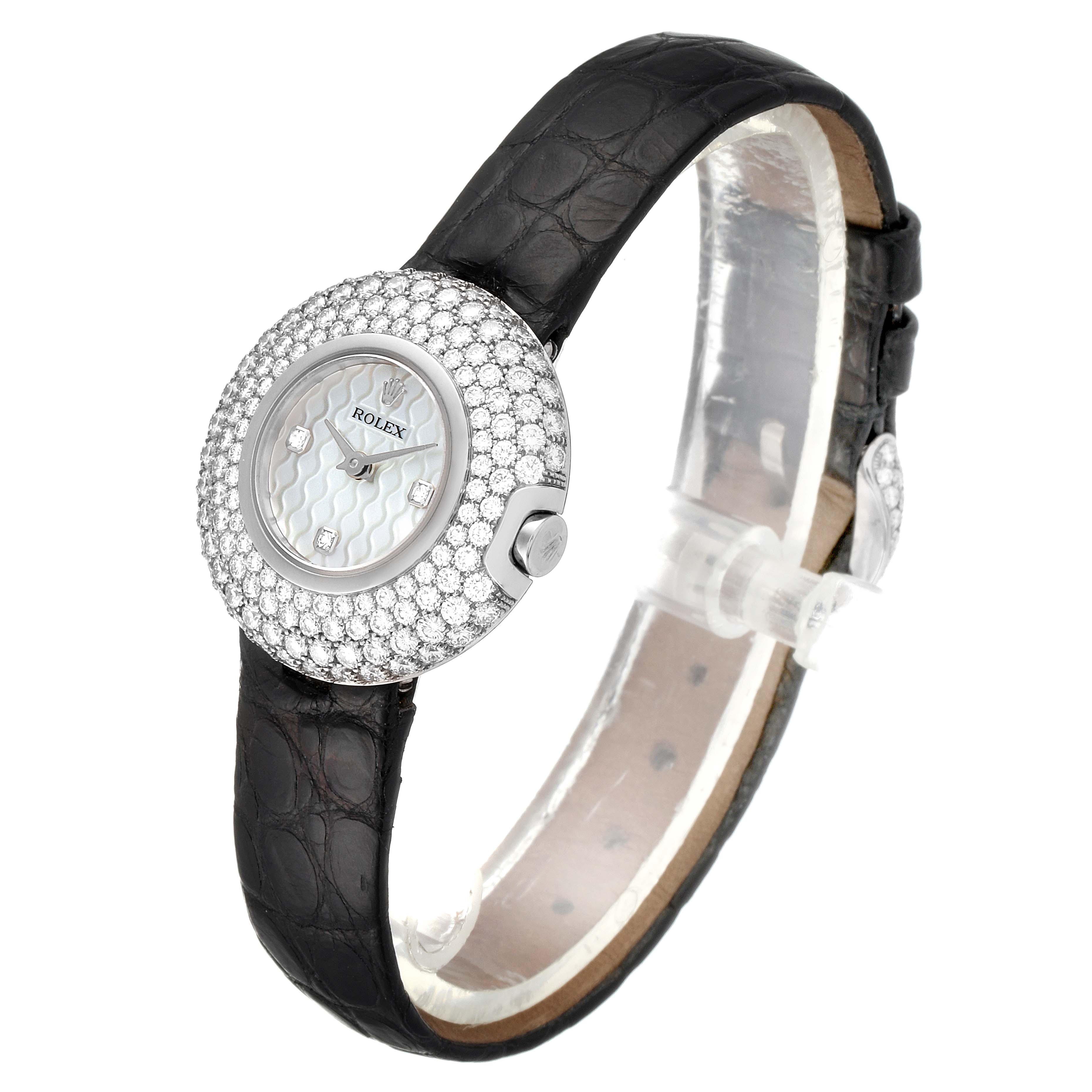 This image shows a Rolex Cellini 6201 Women's White Gold Mother of Pearl Dial 6201 Women's White Gold Mother of Pearl Dial watch at a three-quarter angle, highlighting its diamond-studded bezel, mother-of-pearl dial, and black leather strap.