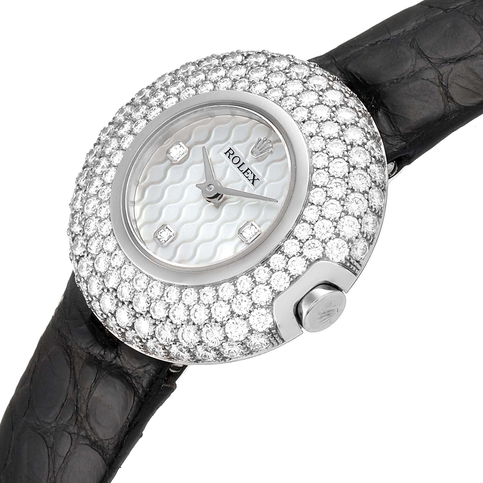 The image shows a close-up of a Rolex Cellini 6201 Women's White Gold Mother of Pearl Dial 6201 Women's White Gold Mother of Pearl Dial watch, highlighting its diamond-encrusted bezel and leather strap.