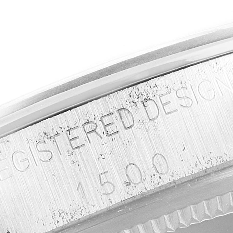 This close-up image shows the edge of the watch case with engraved text and numbers from the Vintage Collection model by Rolex.