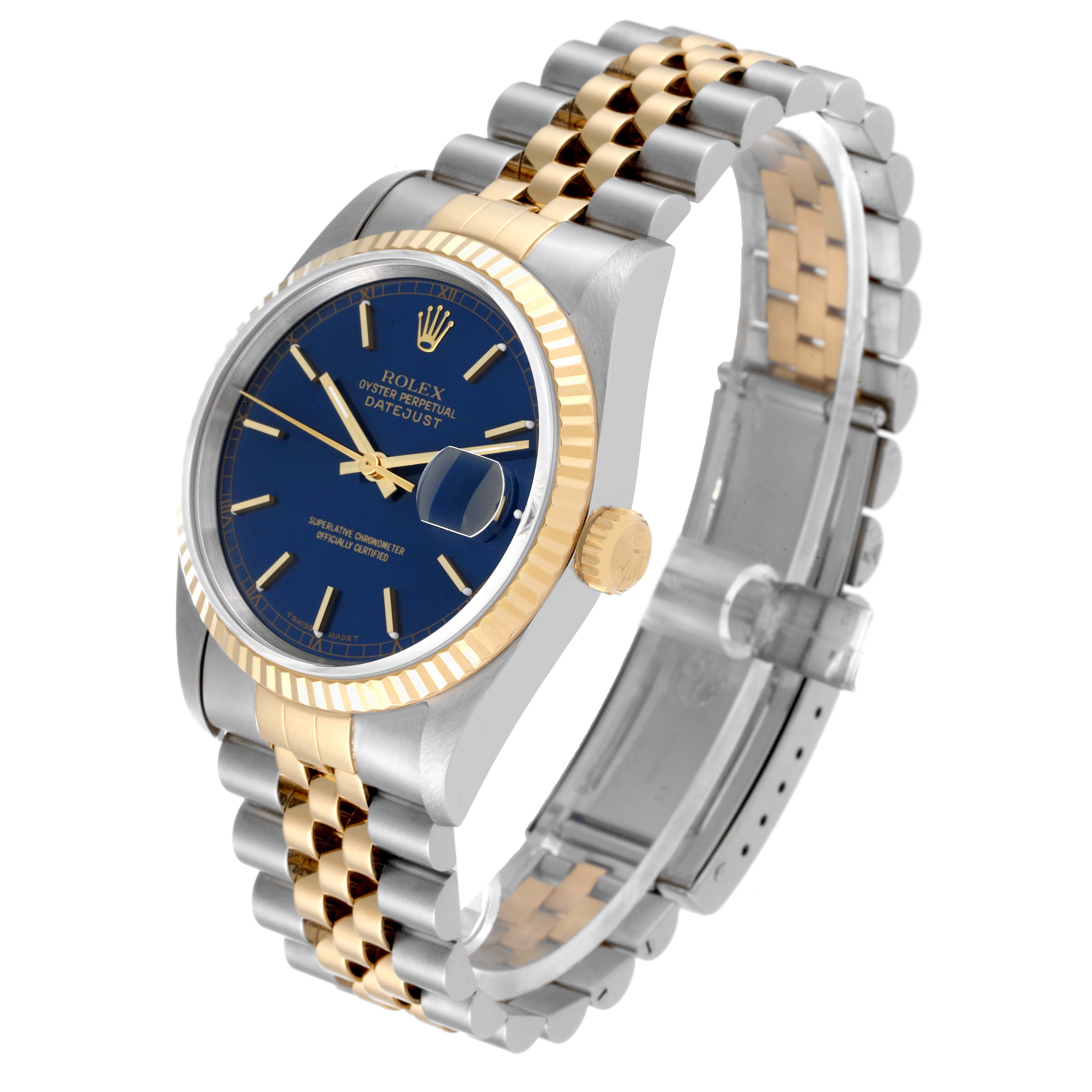 The image shows a Rolex Datejust 16233 Men's Steel and Gold (two tone) Blue Dial 16233 Men's Steel and Gold (two tone) Blue Dial watch from a three-quarter angle, highlighting the blue dial, fluted bezel, two-tone bracelet, and crown.