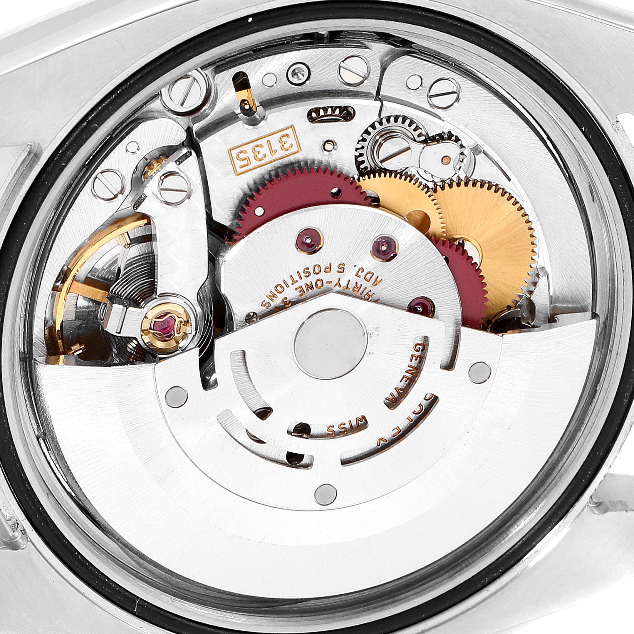 The image shows the intricate inner mechanism of a Rolex Datejust 116233 Men's Steel and Gold (two tone) Champagne Dial 116233 Men's Steel and Gold (two tone) Champagne Dial watch, viewed from the back.