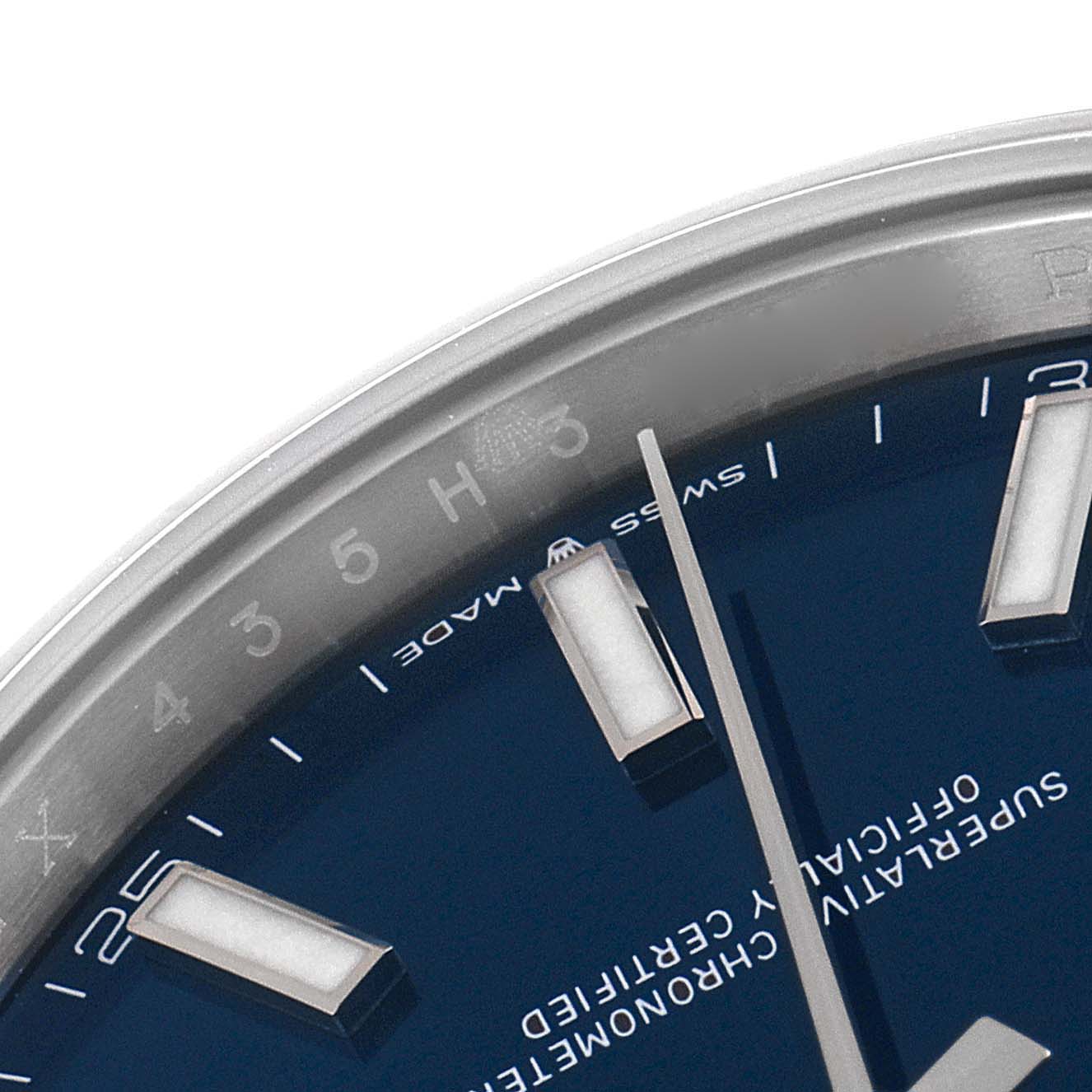 This image shows a close-up of the dial, indices, and hands of a Rolex Datejust 41 126300 Men's Stainless Steel Blue Dial 126300 Men's Stainless Steel Blue Dial watch.