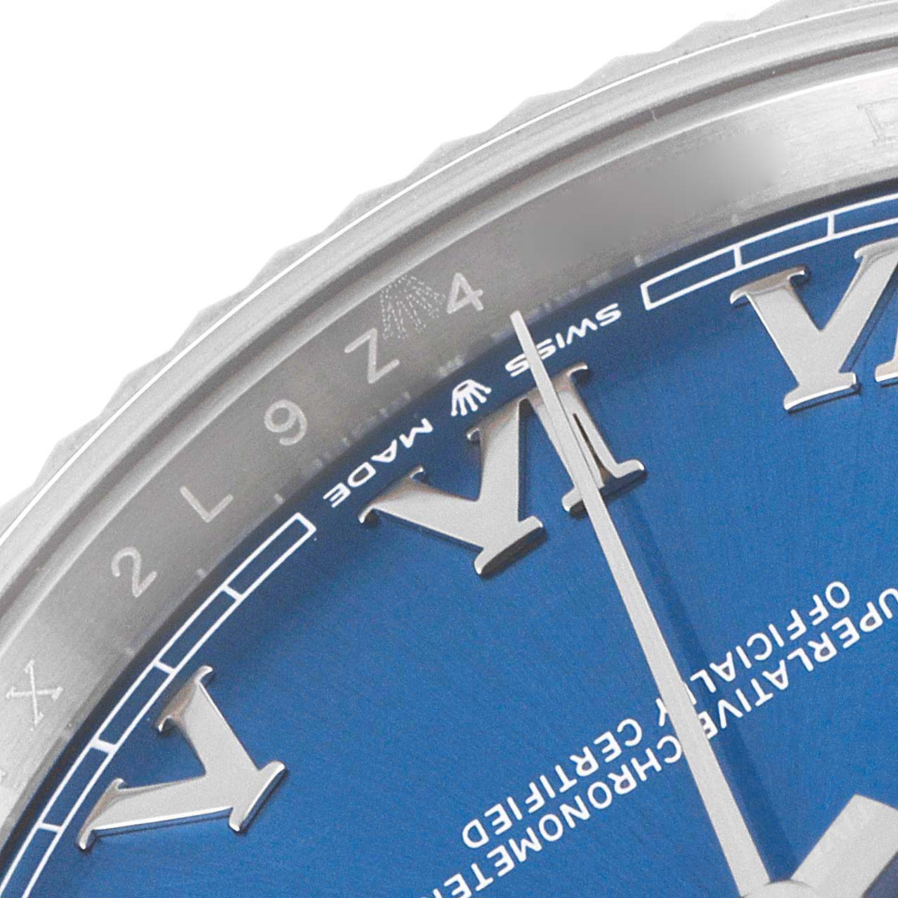 This image shows a close-up of the dial and bezel of a Rolex Datejust 41 126334 Men's Stainless Steel Blue Dial 126334 Men's Stainless Steel Blue Dial, emphasizing the Roman numerals and part of the minute hand.