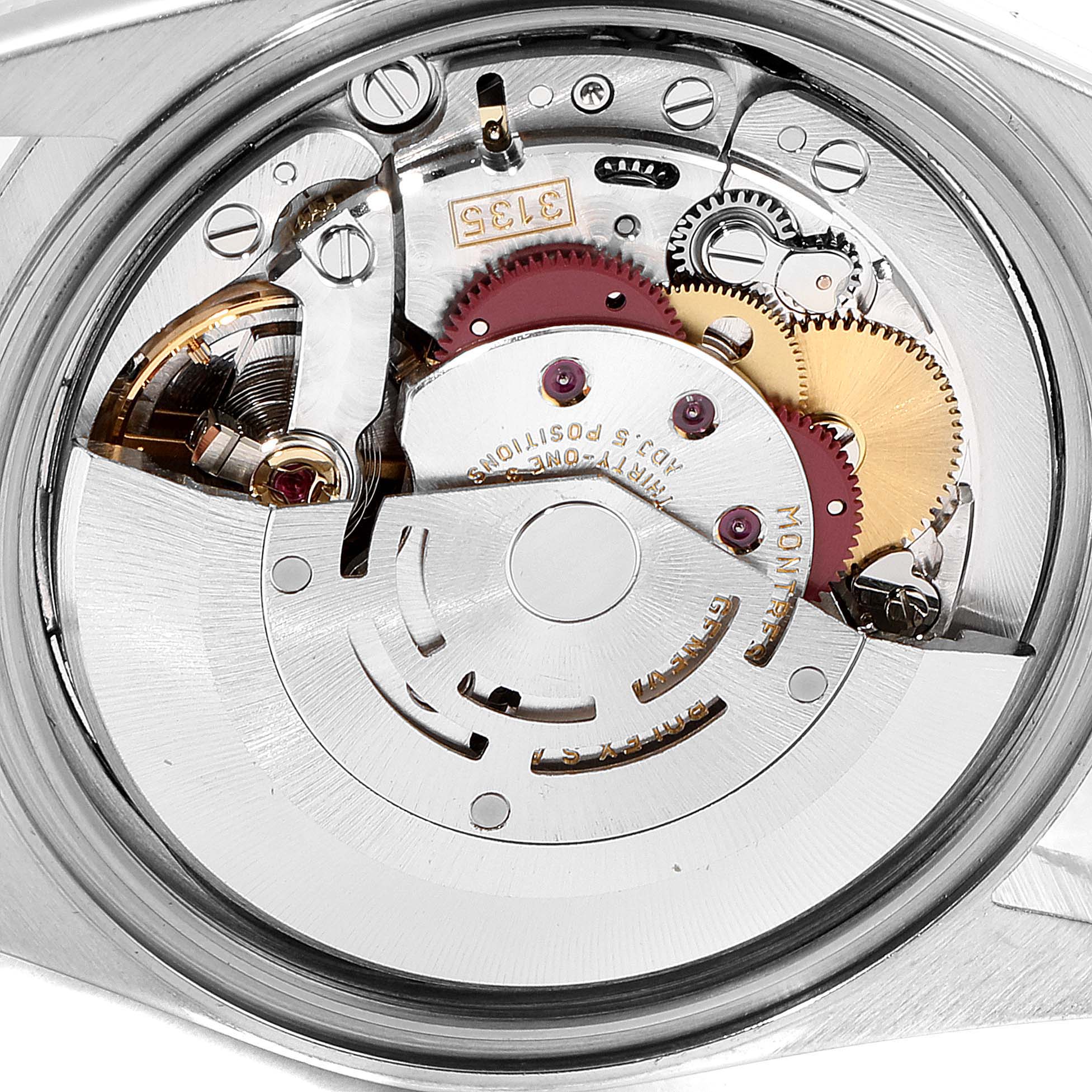 The image shows an internal view of the Rolex Datejust 16200 Men's Stainless Steel Blue Dial 16200 Men's Stainless Steel Blue Dial watch, focusing on its intricate movement components.