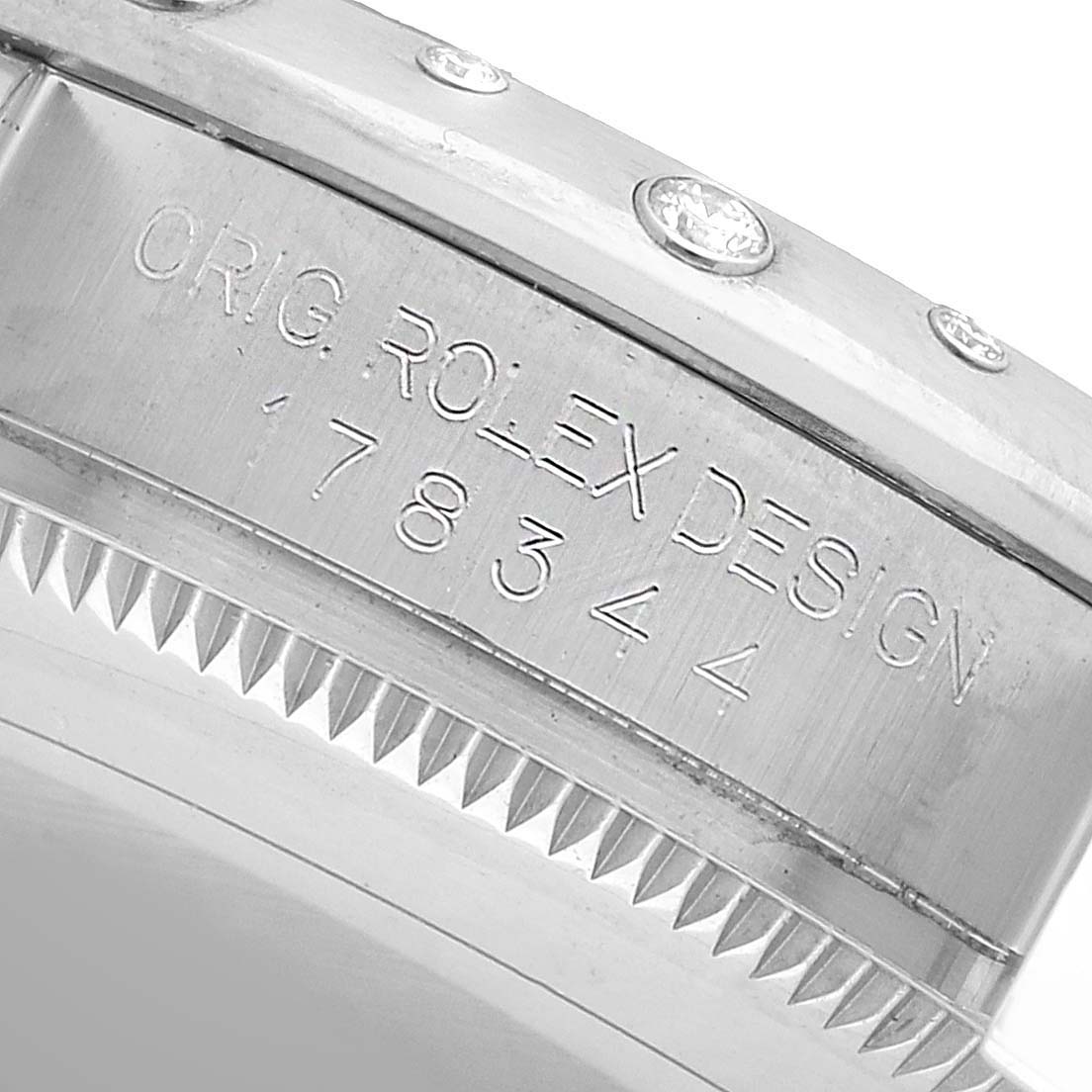 The image shows a close-up of the side of a Rolex Datejust 178344 Women's Stainless Steel Black Dial, highlighting the engraved design and model number.