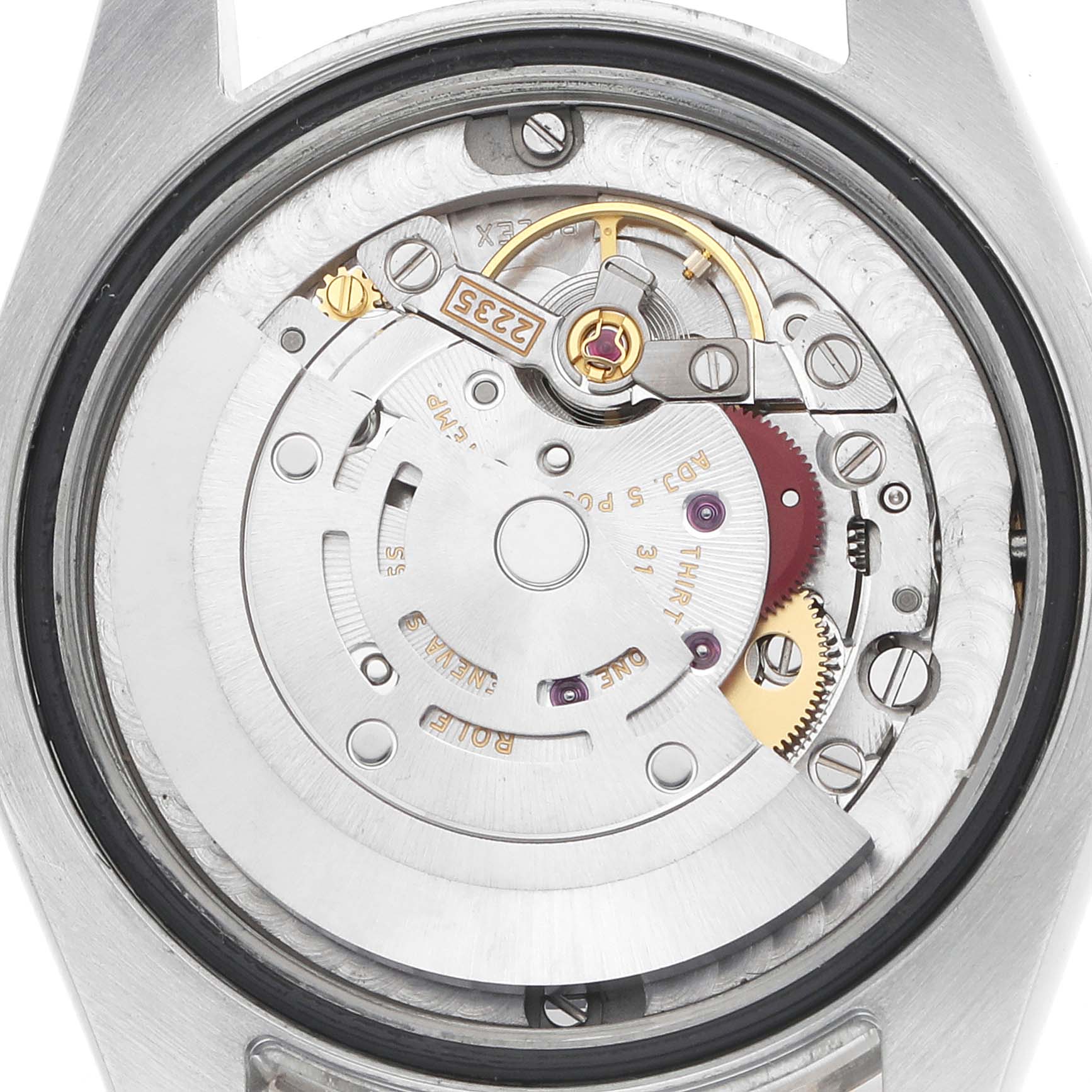 The image shows the Rolex Datejust 178384 Women's Stainless Steel Mother of Pearl Dial's movement from the back, revealing the rotor and intricate gears.