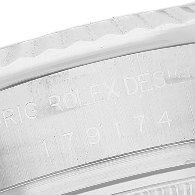 This image shows a close-up of the engraving on the case of a Rolex Datejust 179174 Women's Stainless Steel Mother of Pearl Dial 179174 Women's Stainless Steel Mother of Pearl Dial model.