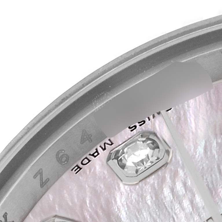 This image shows a partial close-up view of the dial and bezel of a Rolex Datejust 179174 Women's Stainless Steel Mother of Pearl Dial 179174 Women's Stainless Steel Mother of Pearl Dial watch.