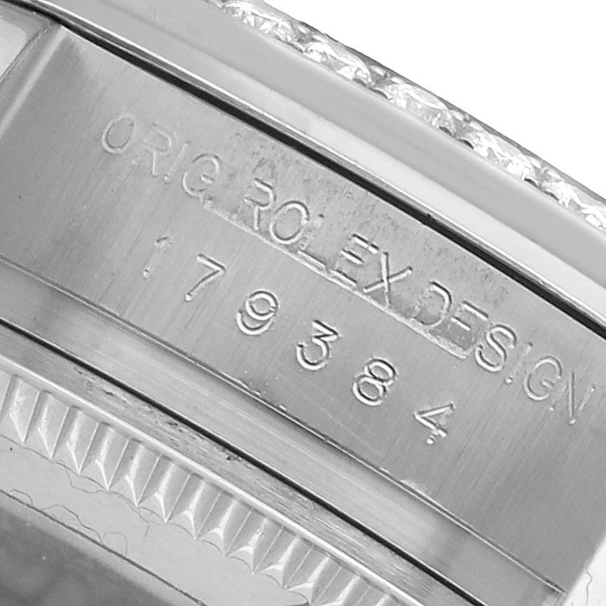 The image shows a close-up of the Rolex Datejust 179384 Women's Stainless Steel Pink Dial model's inner bezel, displaying the model and design numbers.
