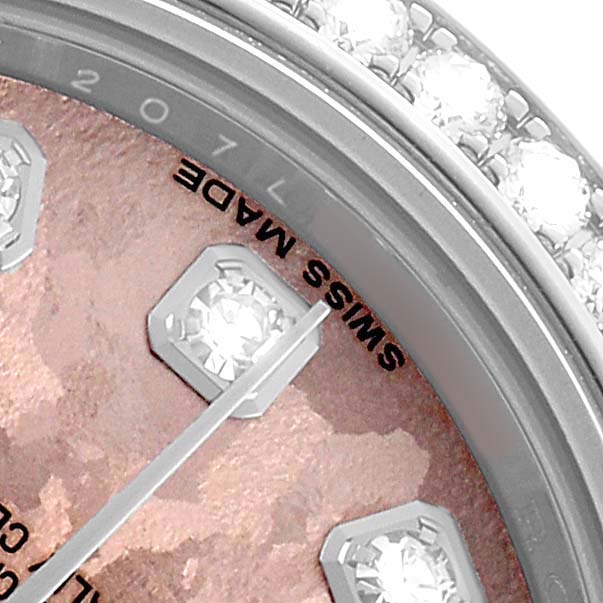 The image shows a close-up of the Rolex Datejust 179384 Women's Stainless Steel Pink Dial dial and bezel, highlighting diamond markers and the "SWISS MADE" text.